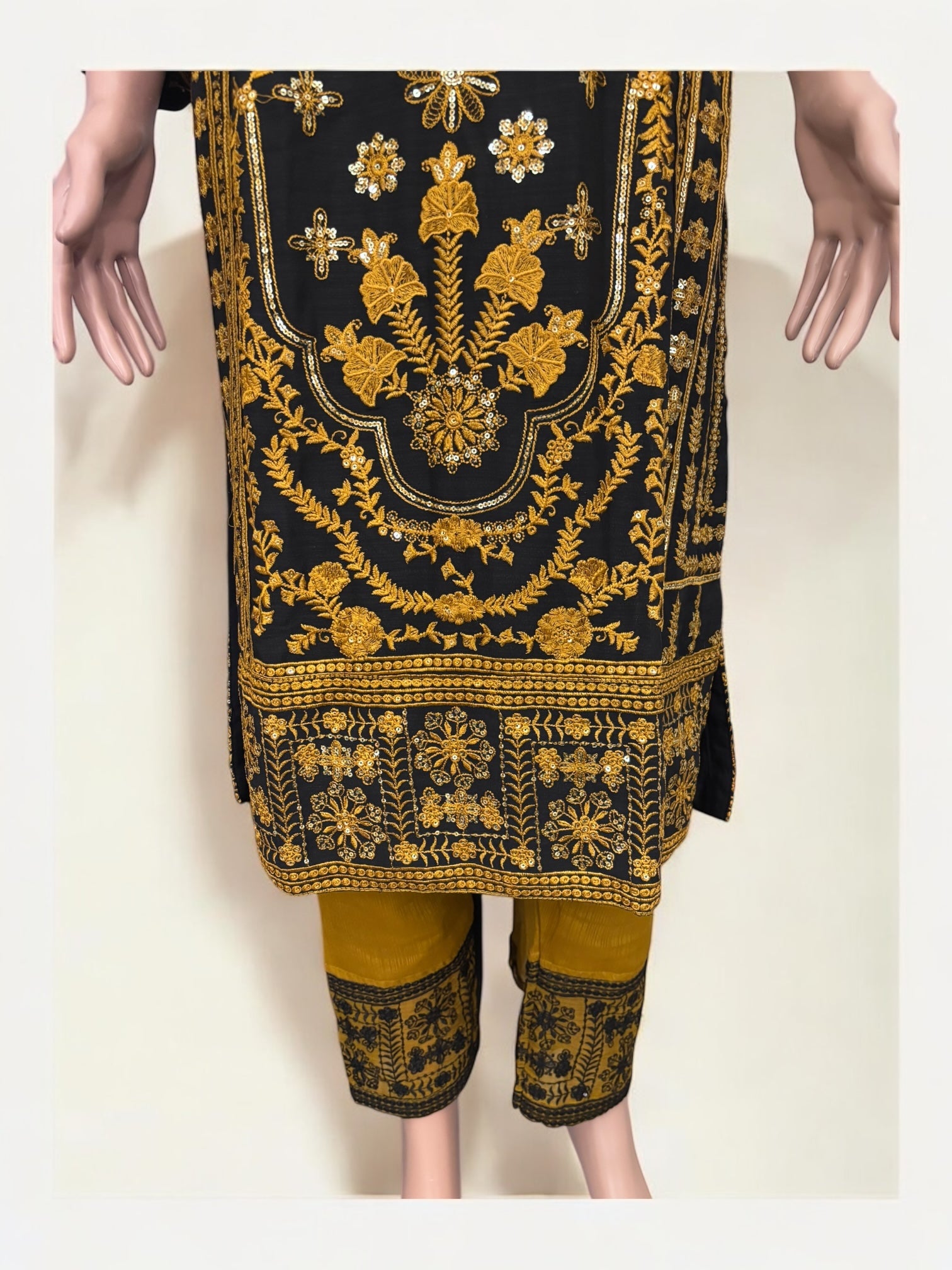 Traditional designer Salwar Kameez suit by Saree Ghor Charlotte, elegant ethnic wear for women with intricate fabric and vibrant colors.