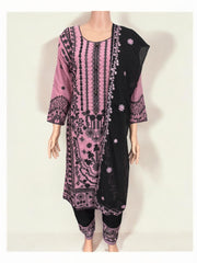 Traditional designer Salwar Kameez suit by Saree Ghor Charlotte featuring intricate ethnic embroidery and vibrant fabric details.