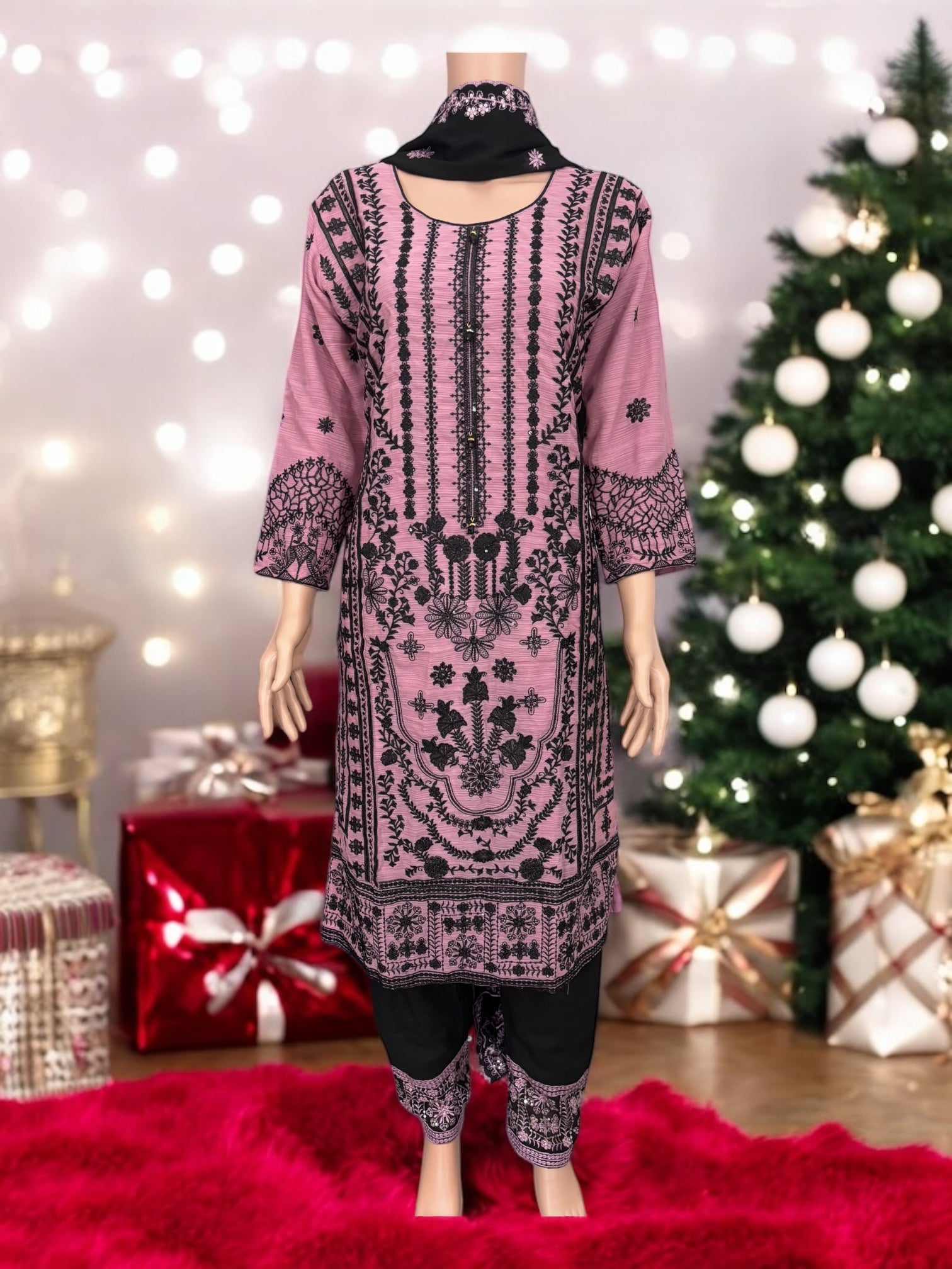 Traditional designer Salwar Kameez suit by Saree Ghor Charlotte, elegant ethnic wear for women with intricate patterns and vibrant colors.
