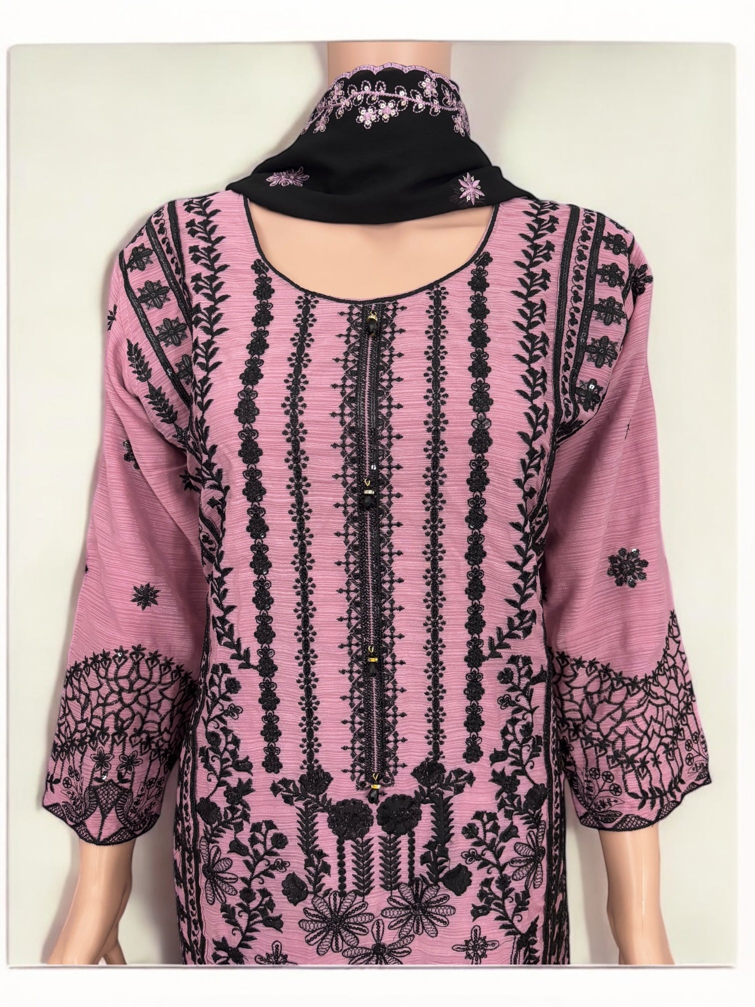 Traditional designer Salwar Kameez suit by Saree Ghor Charlotte, elegant ethnic wear for women with intricate details.