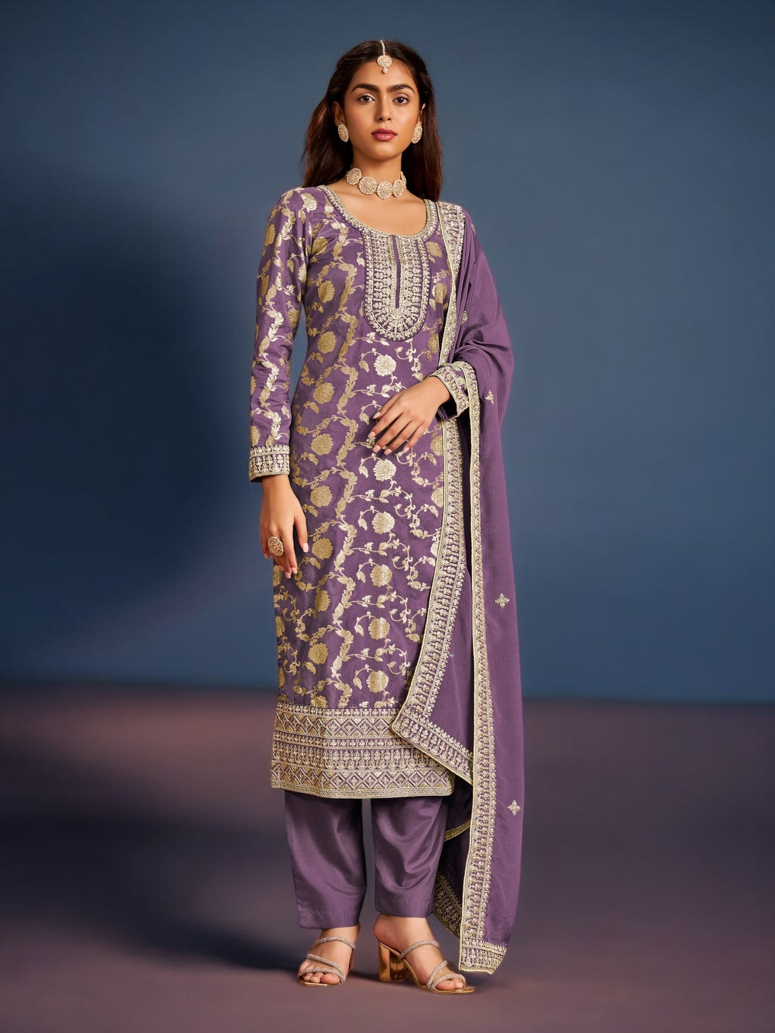 Traditional designer Salwar Kameez suit by Saree Ghor Charlotte, featuring intricate ethnic embroidery and vibrant fabric for women.