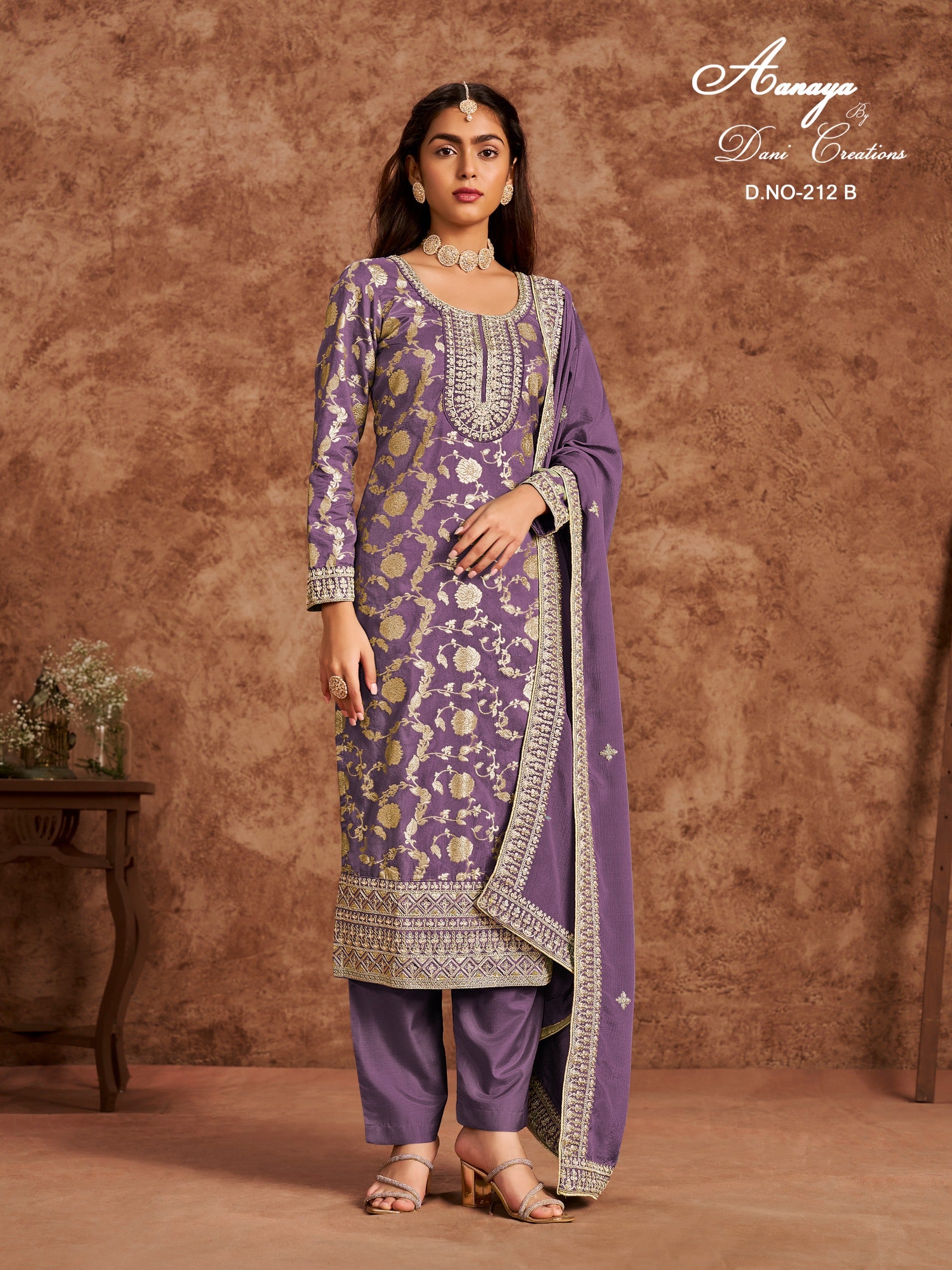 Traditional designer Salwar Kameez suit by Saree Ghor Charlotte, featuring intricate ethnic embroidery and vibrant fabric for women.