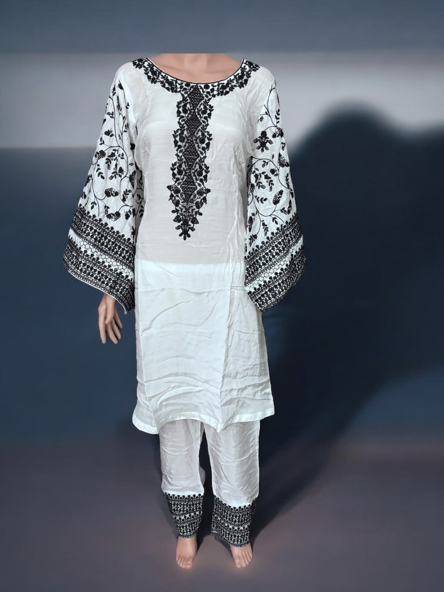 Traditional designer Salwar Kameez suit by Saree Ghor Charlotte, elegant ethnic wear for women with intricate detailing.