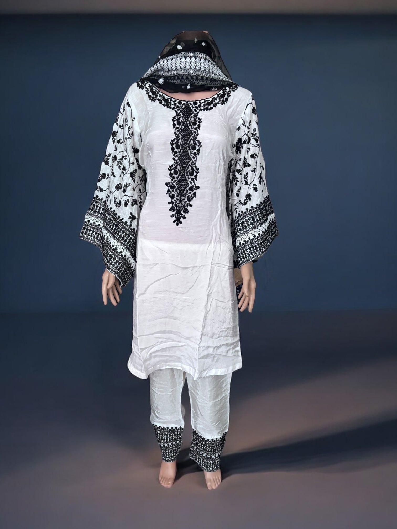 Traditional designer Salwar Kameez suit by Saree Ghor Charlotte, ethnic wear for women, featuring intricate patterns and elegant fabric.