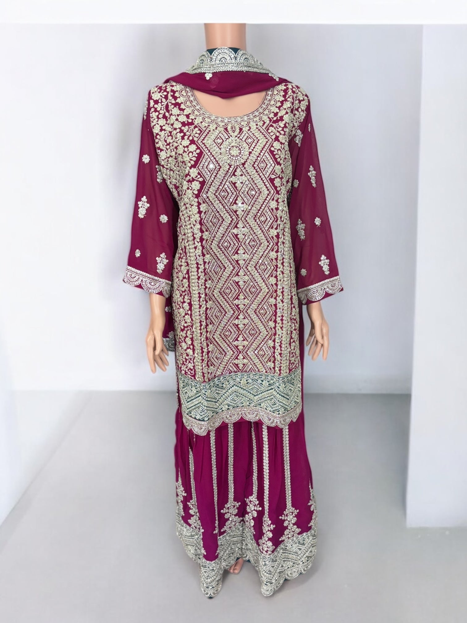 Traditional designer Sharara Garara Salwar Kameez suit by Saree Ghor Charlotte, showcasing intricate ethnic wear with vibrant patterns.