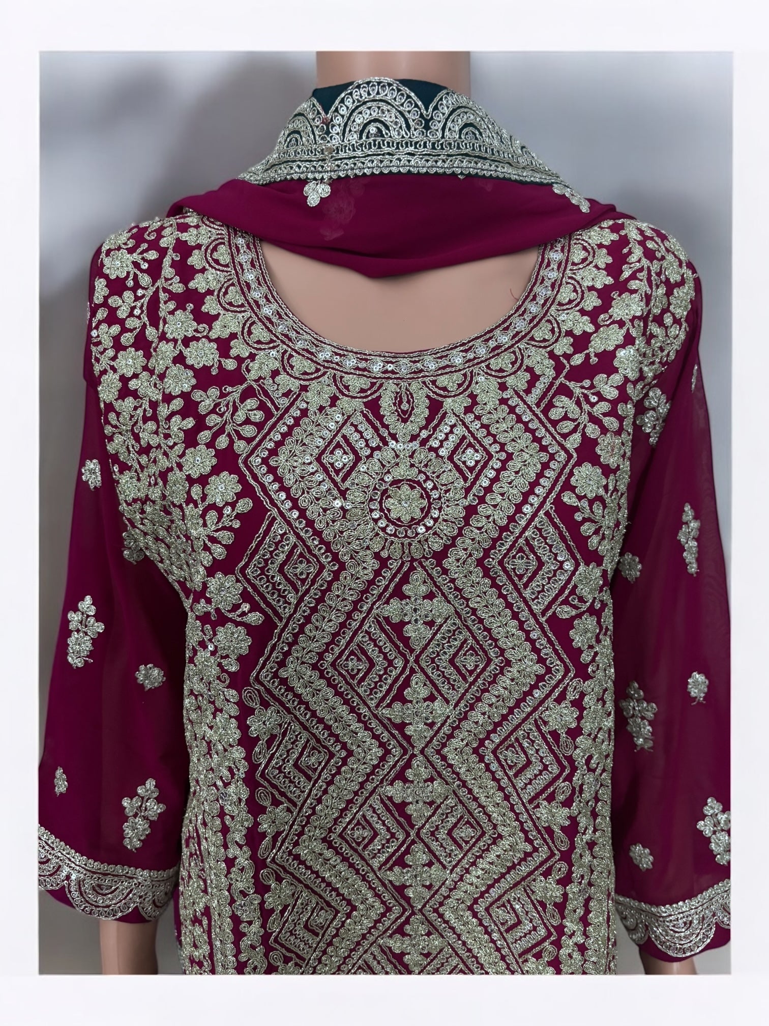 Traditional designer Sharara Garara Salwar Kameez suit by Saree Ghor Charlotte, showcasing intricate ethnic embroidery and vibrant fabric.