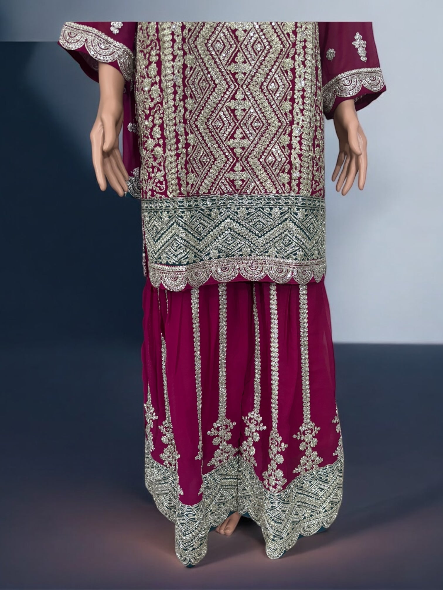 Traditional designer Sharara Garara Salwar Kameez suit by Saree Ghor Charlotte, showcasing intricate ethnic embroidery and vibrant fabric.
