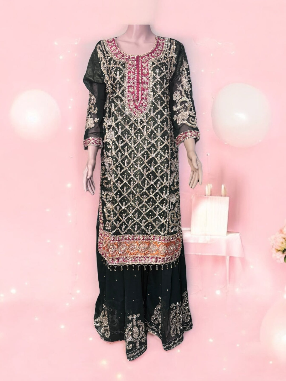 Traditional designer Sharara Salwar Kameez set by Saree Ghor Charlotte, ethnic women's wear with intricate embroidery and vibrant colors.