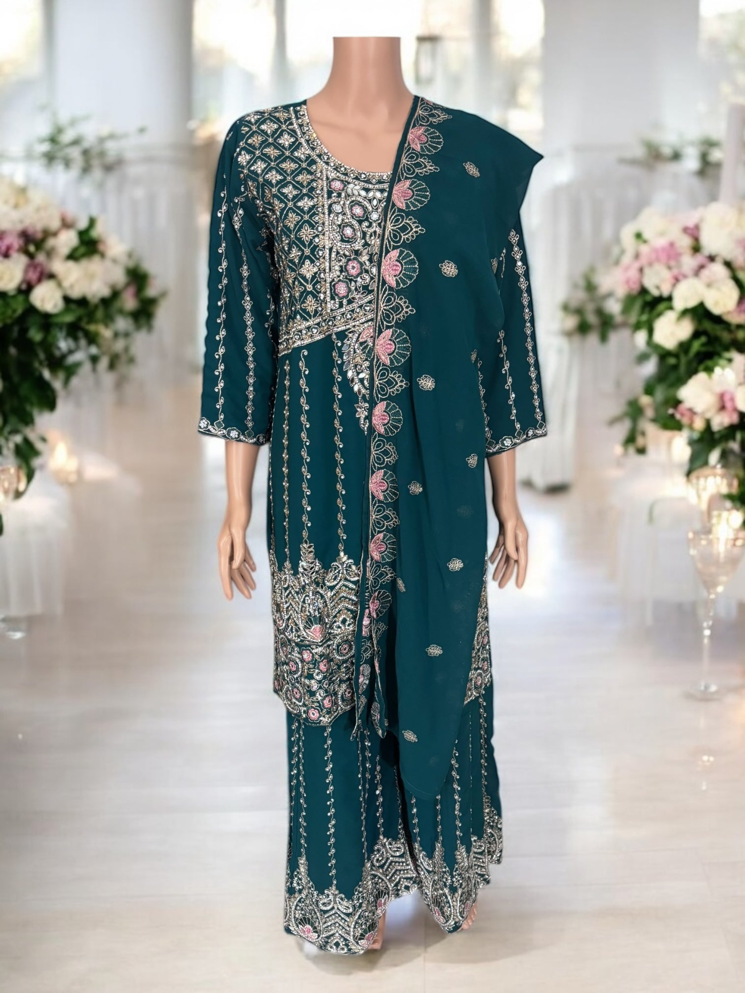 Traditional Saree Ghor Charlotte Salwar Kameez suit with intricate embroidery, showcasing ethnic wear in vibrant colors.