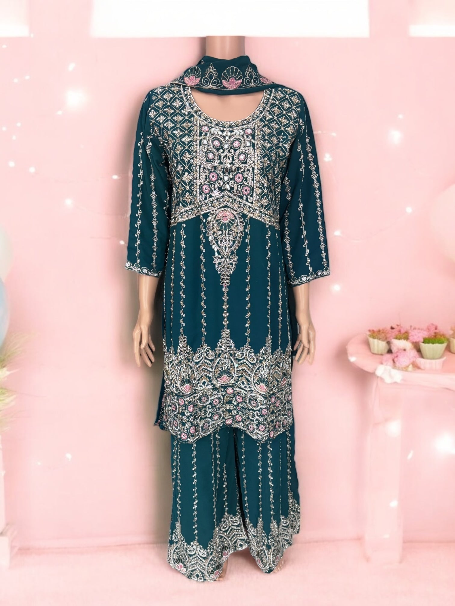 Traditional designer Sharara Salwar Kameez suit by Saree Ghor Charlotte, featuring intricate ethnic fabric and detailed embroidery.