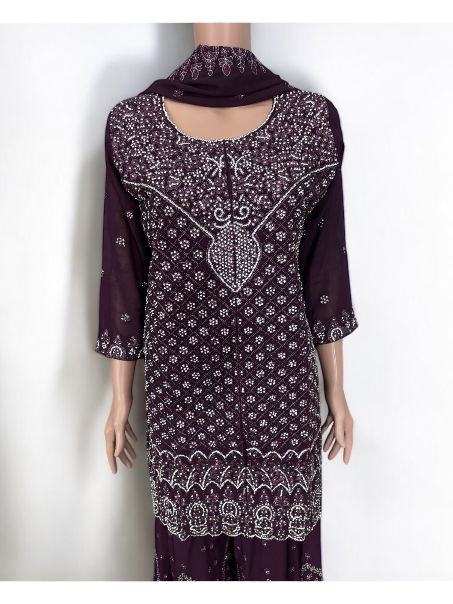 Traditional Designer Sharara Salwar Kameez suit by Saree Ghor Charlotte, showcasing intricate ethnic wear with vibrant fabric and elegant design.