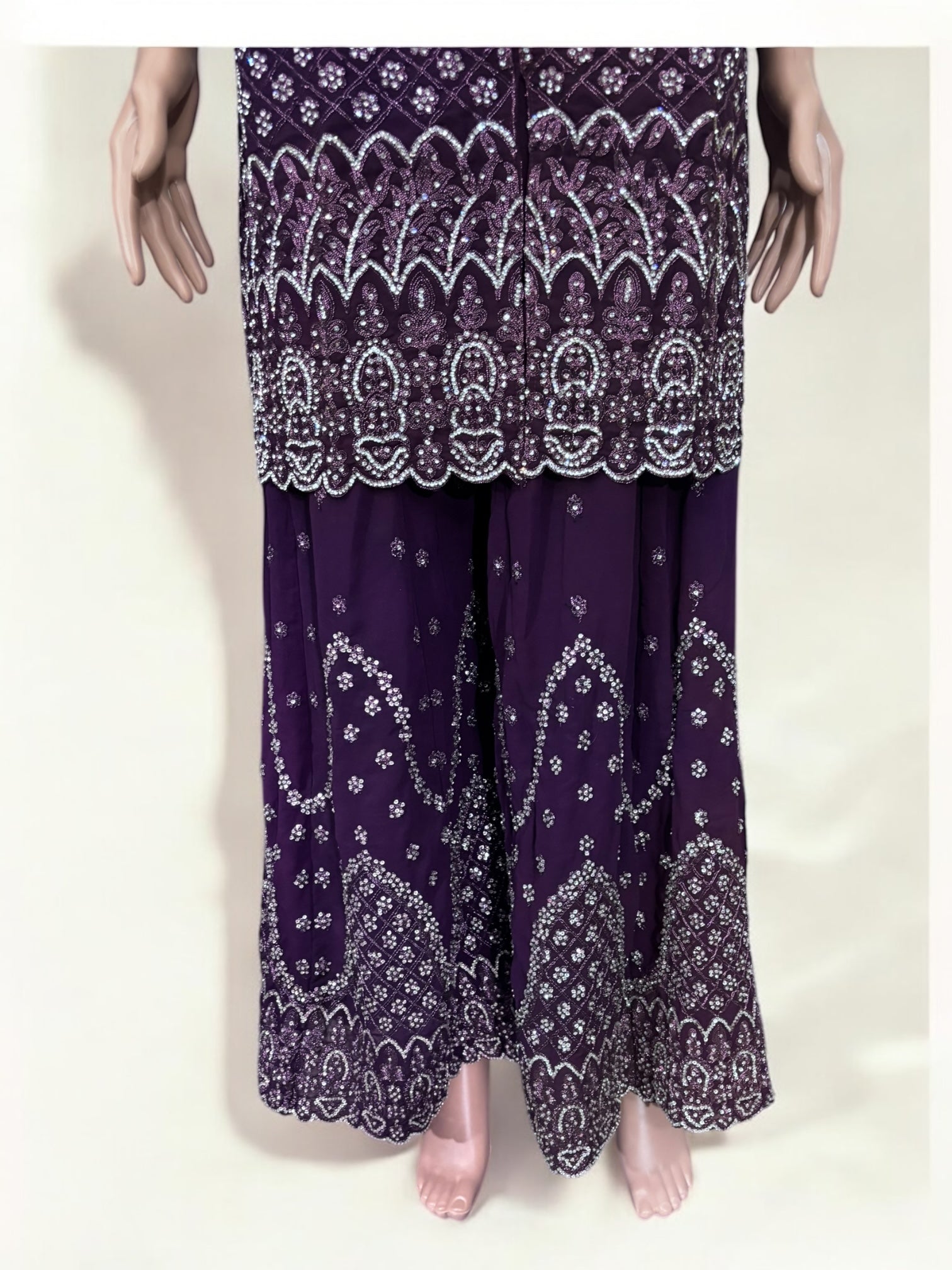 Traditional designer Sharara Salwar Kameez suit by Saree Ghor Charlotte, showcasing vibrant ethnic wear with intricate details.