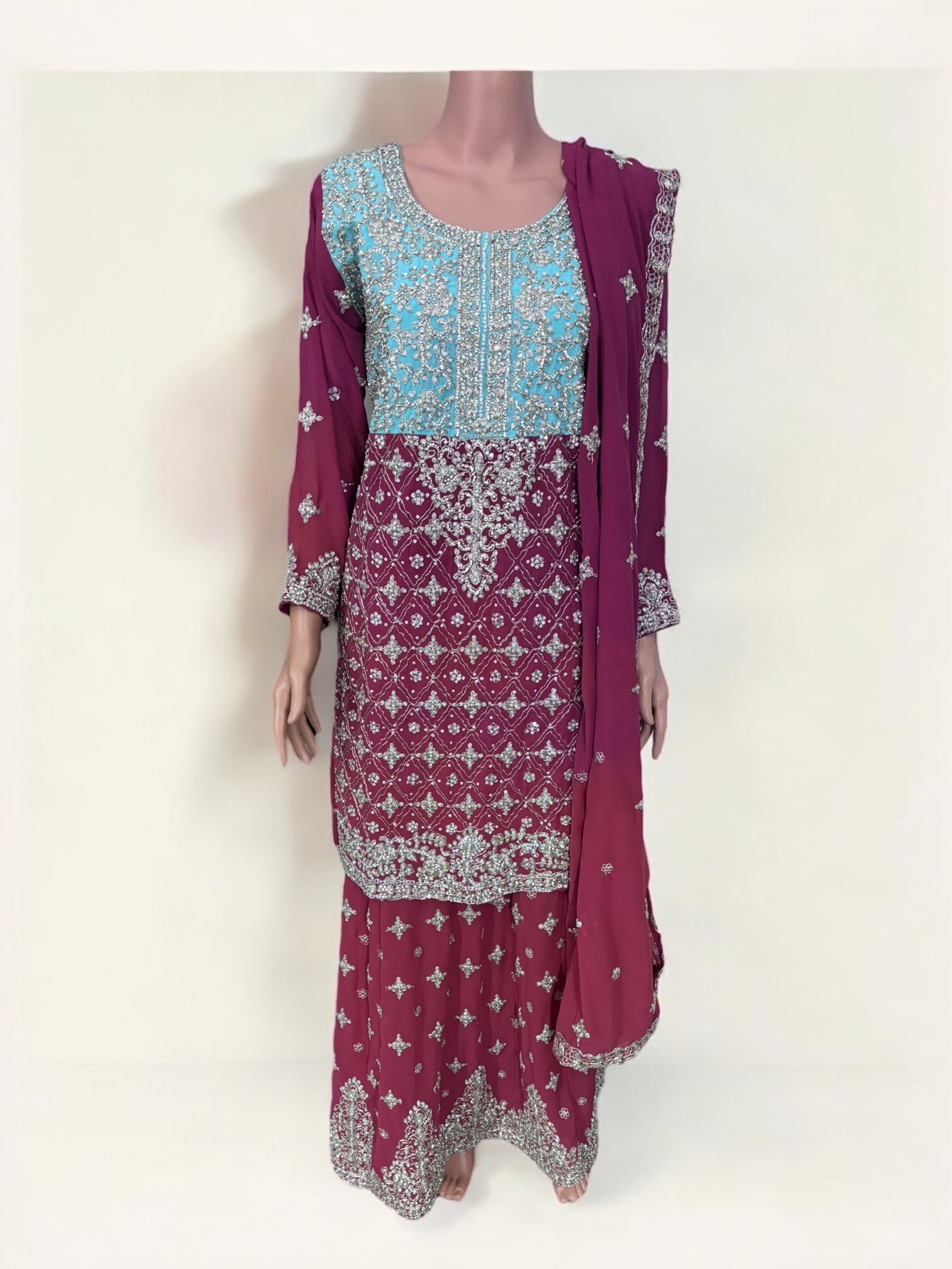 Traditional designer Sharara Salwar Kameez suit in lehenga style by Saree Ghor Charlotte, with intricate ethnic embroidery.