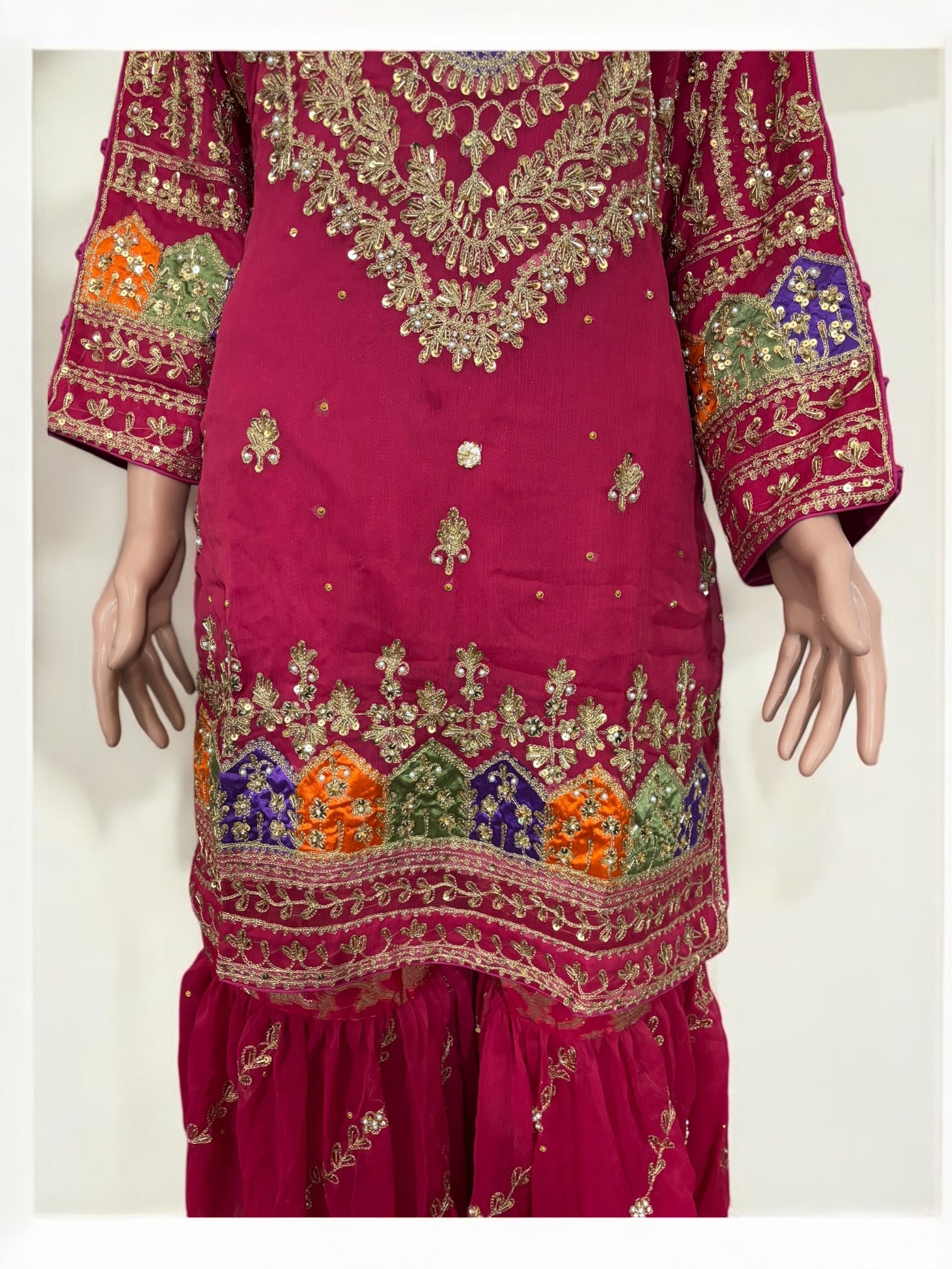 Traditional Garara designer Salwar Kameez suit by Saree Ghor Charlotte, featuring intricate ethnic embroidery and vibrant fabric.
