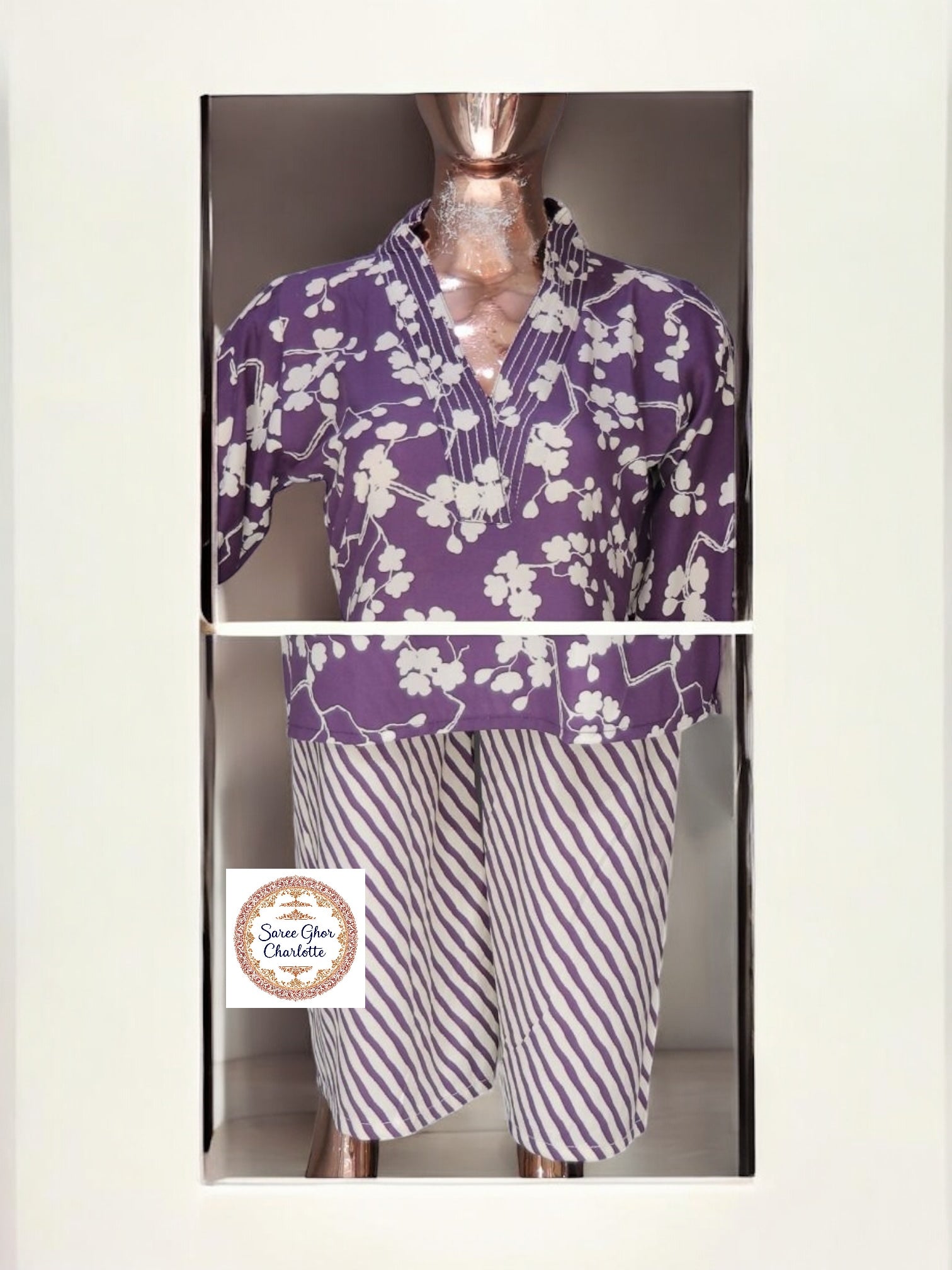 Traditional Kurti set by Saree Ghor Charlotte featuring a salwar kameez with intricate ethnic design for women.