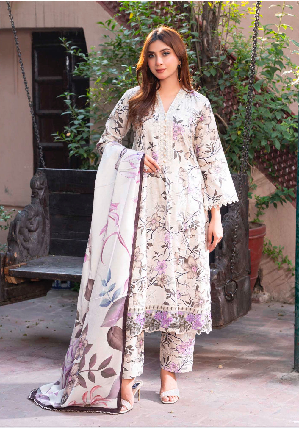 Traditional Pakistani Salwar Kameez by Saree Ghor Charlotte, ethnic women's wear with intricate embroidery and vibrant fabric.