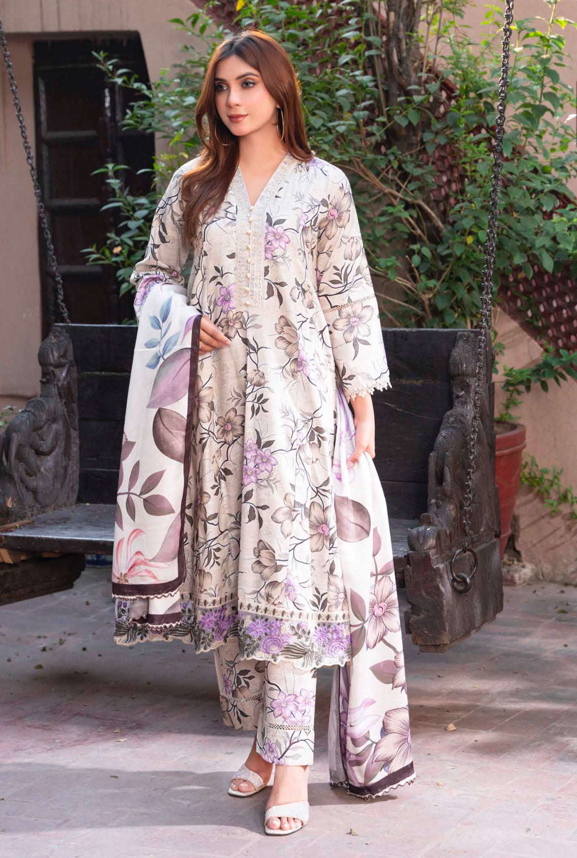 Traditional Pakistani Salwar Kameez by Saree Ghor Charlotte, featuring vibrant ethnic wear for women with intricate patterns and colorful fabric.