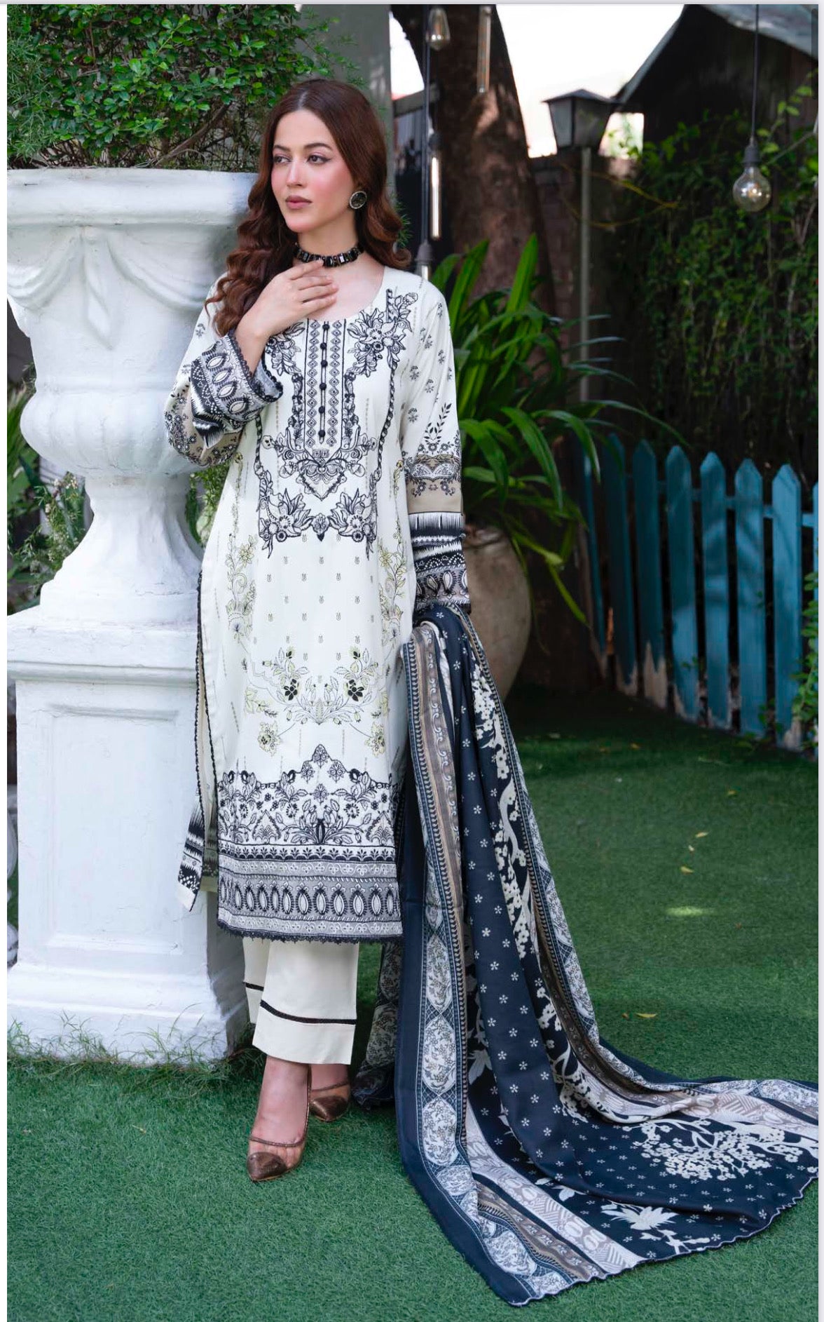 Traditional Pakistani Salwar Kameez by Saree Ghor Charlotte, featuring vibrant ethnic wear for women with intricate designs.