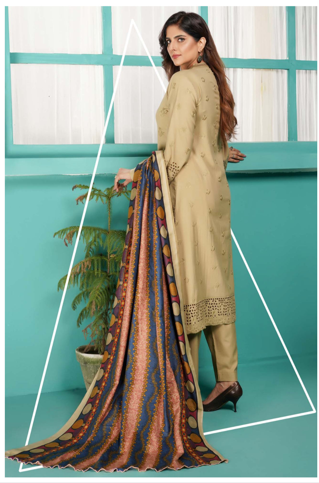 Traditional Pakistani Salwar Kameez by Saree Ghor Charlotte, showcasing intricate embroidery and vibrant ethnic wear for women.
