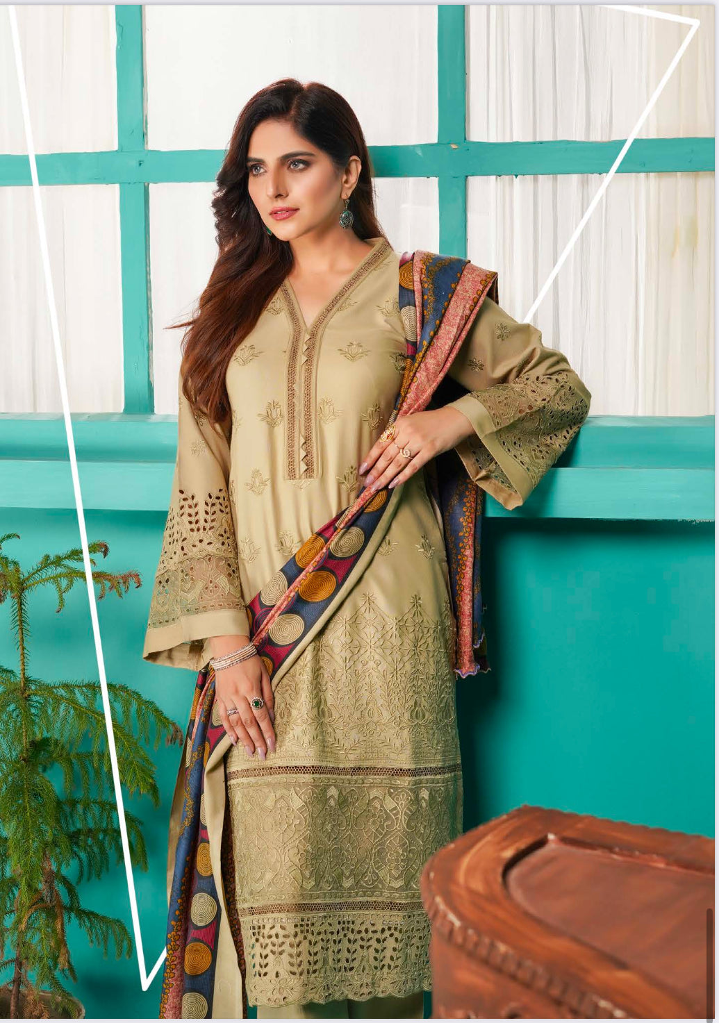 Traditional Pakistani Salwar Kameez by Saree Ghor Charlotte, showcasing vibrant ethnic wear for women with intricate patterns and bright colors.