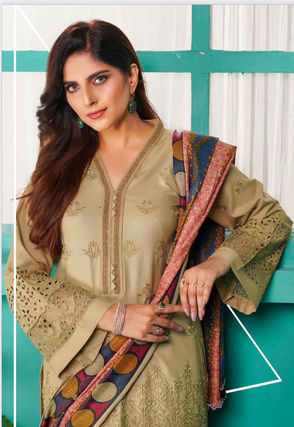 Traditional Pakistani Salwar Kameez by Saree Ghor Charlotte, featuring vibrant ethnic wear for women with intricate patterns and bright colors.