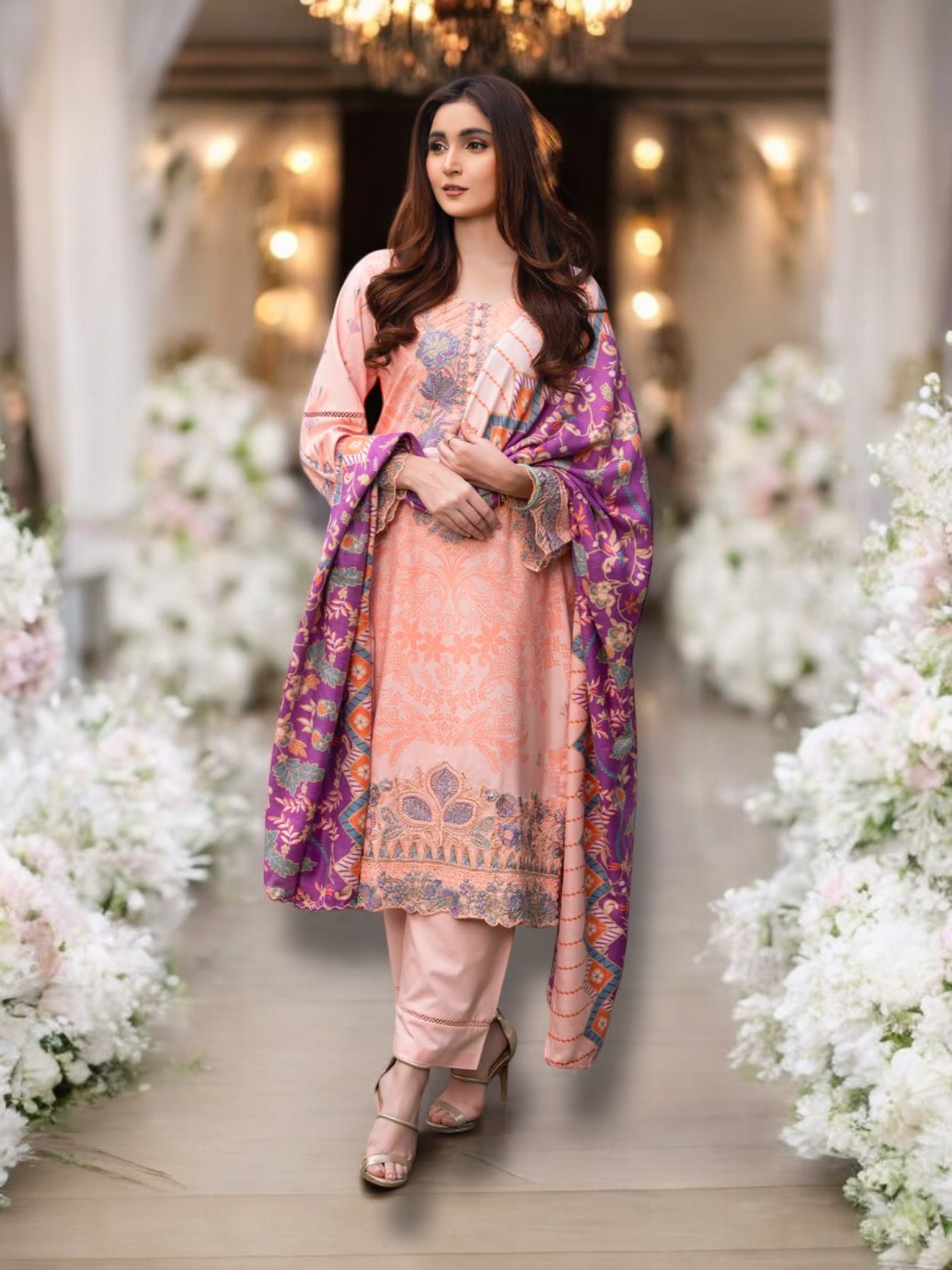 Traditional Pakistani Salwar Kameez by Saree Ghor Charlotte, featuring vibrant ethnic wear for women with intricate embroidery and colorful fabric