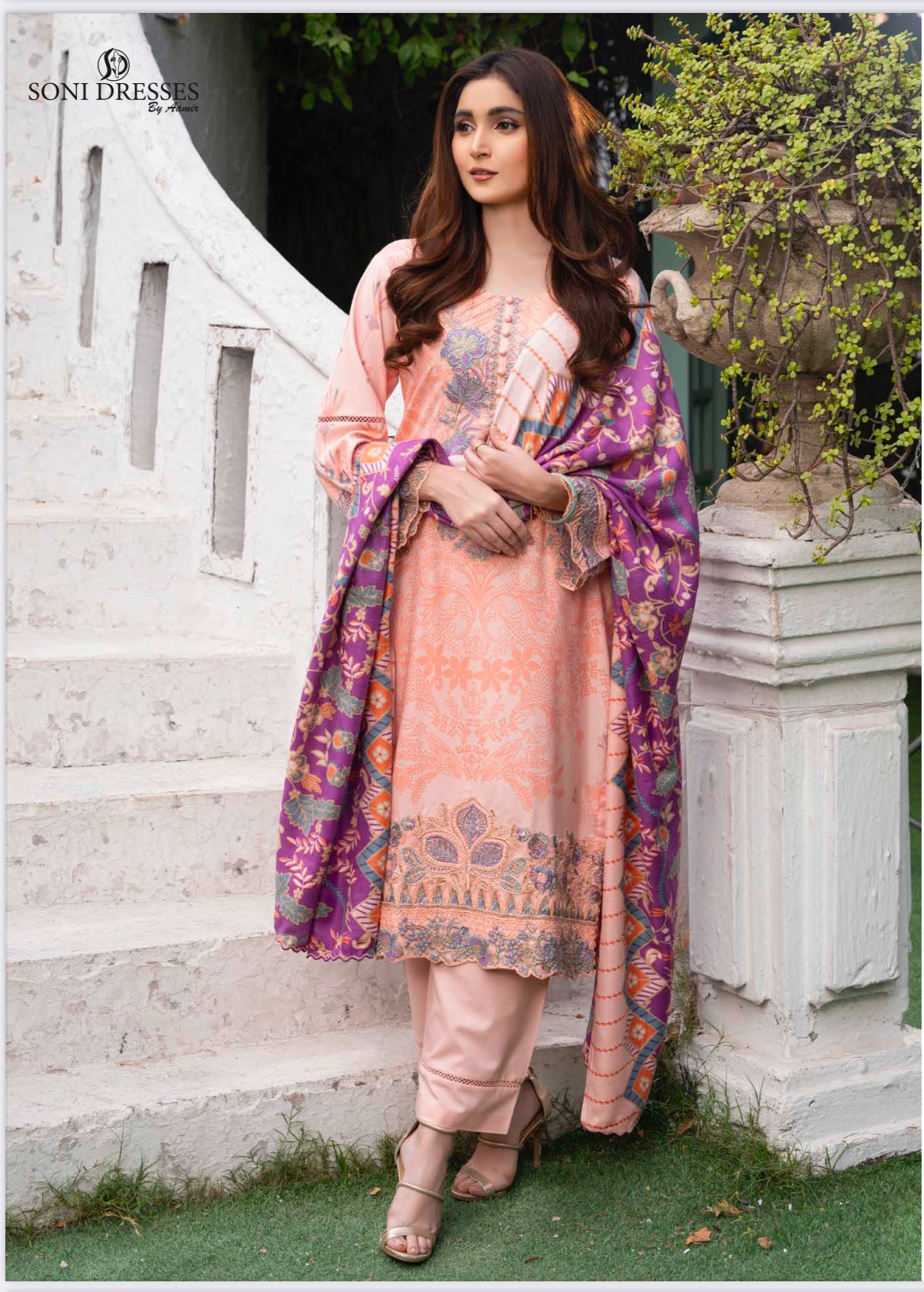 Traditional Pakistani Salwar Kameez by Saree Ghor Charlotte, vibrant ethnic wear with intricate designs for women.