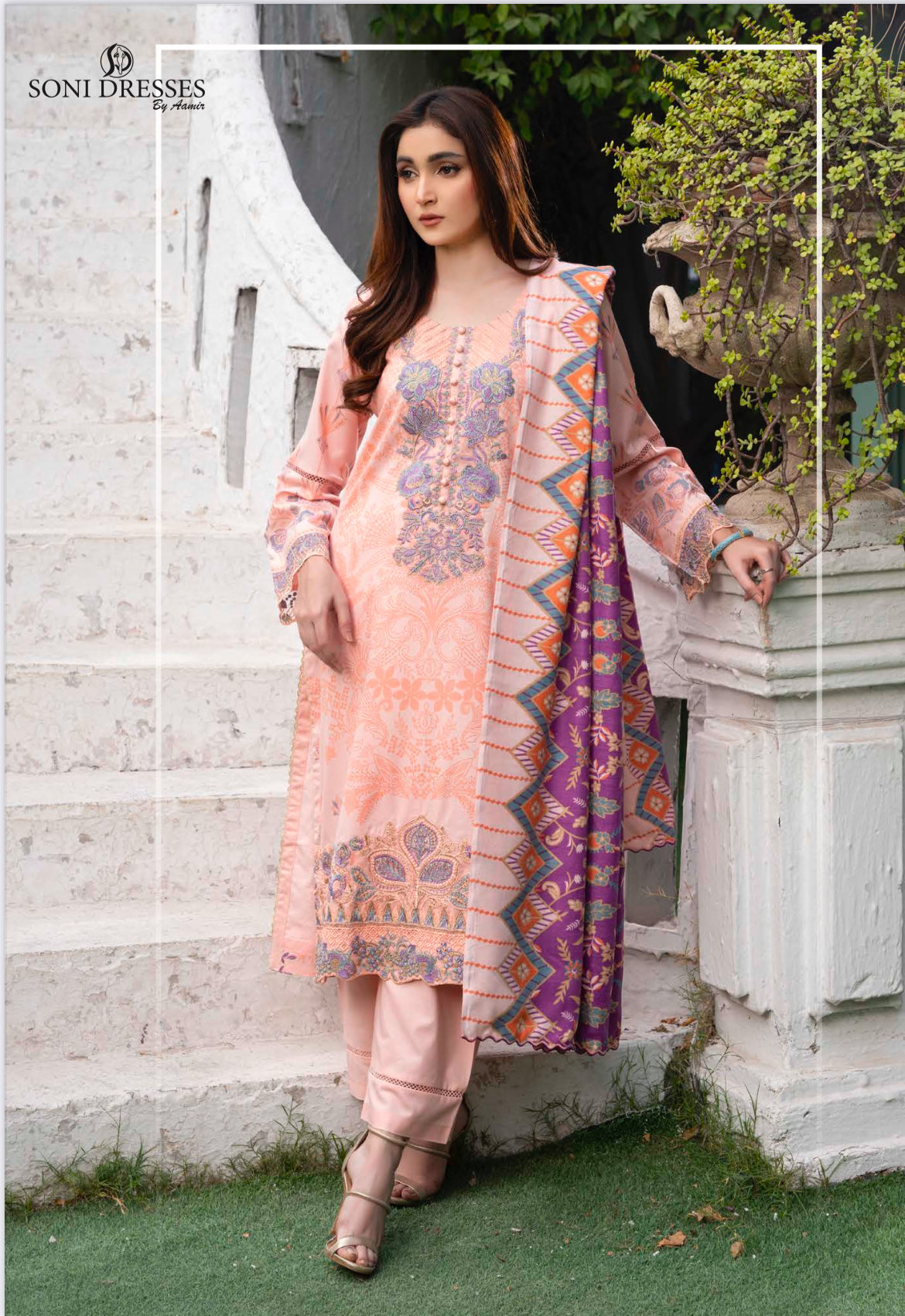 Traditional Pakistani Salwar Kameez by Saree Ghor Charlotte, featuring vibrant ethnic wear for women with colorful fabric and intricate design.