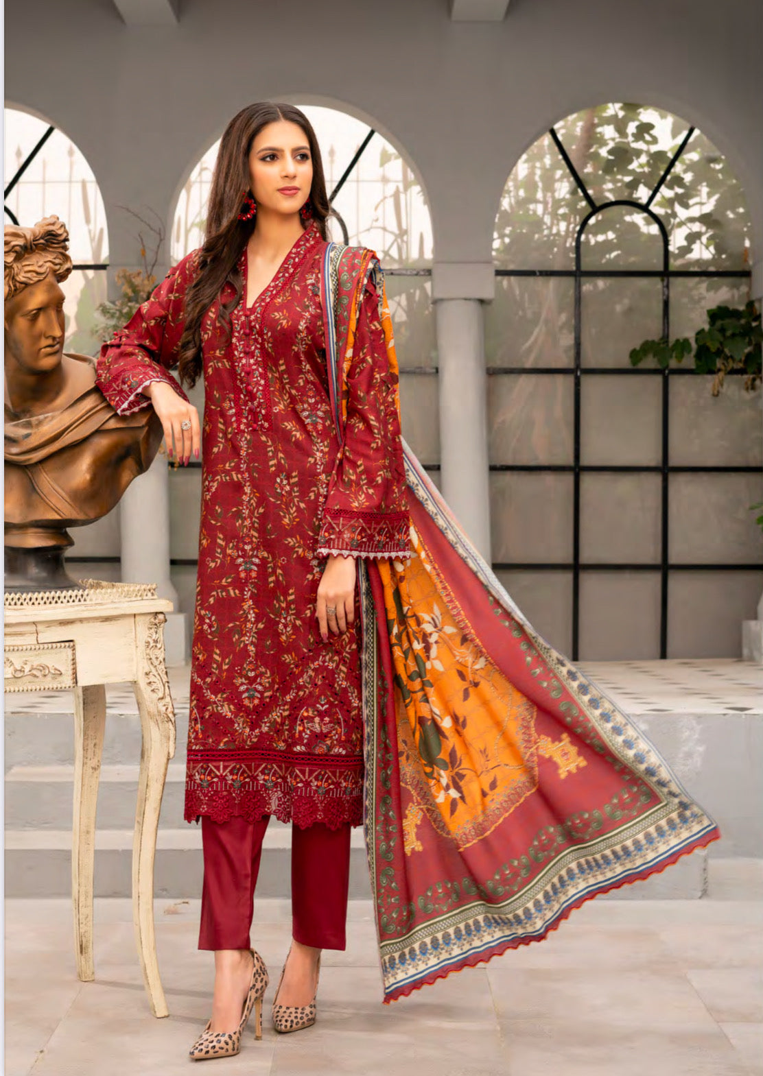 Traditional Pakistani Salwar Kameez by Saree Ghor Charlotte showing vibrant ethnic wear for women with intricate embroidery and colorful fabric.