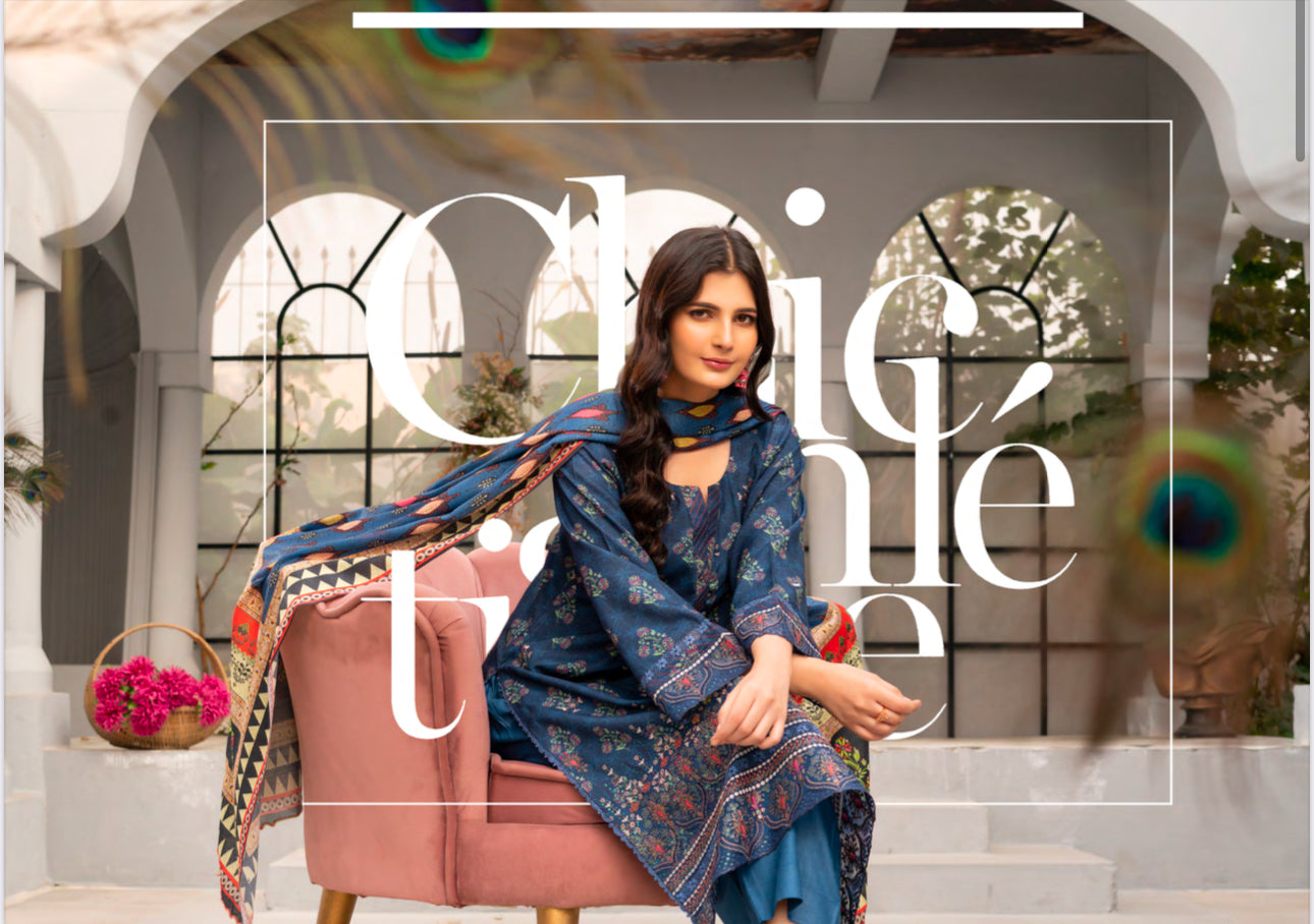Traditional Pakistani Salwar Kameez by Saree Ghor Charlotte, featuring intricate embroidery and vibrant ethnic wear for women.