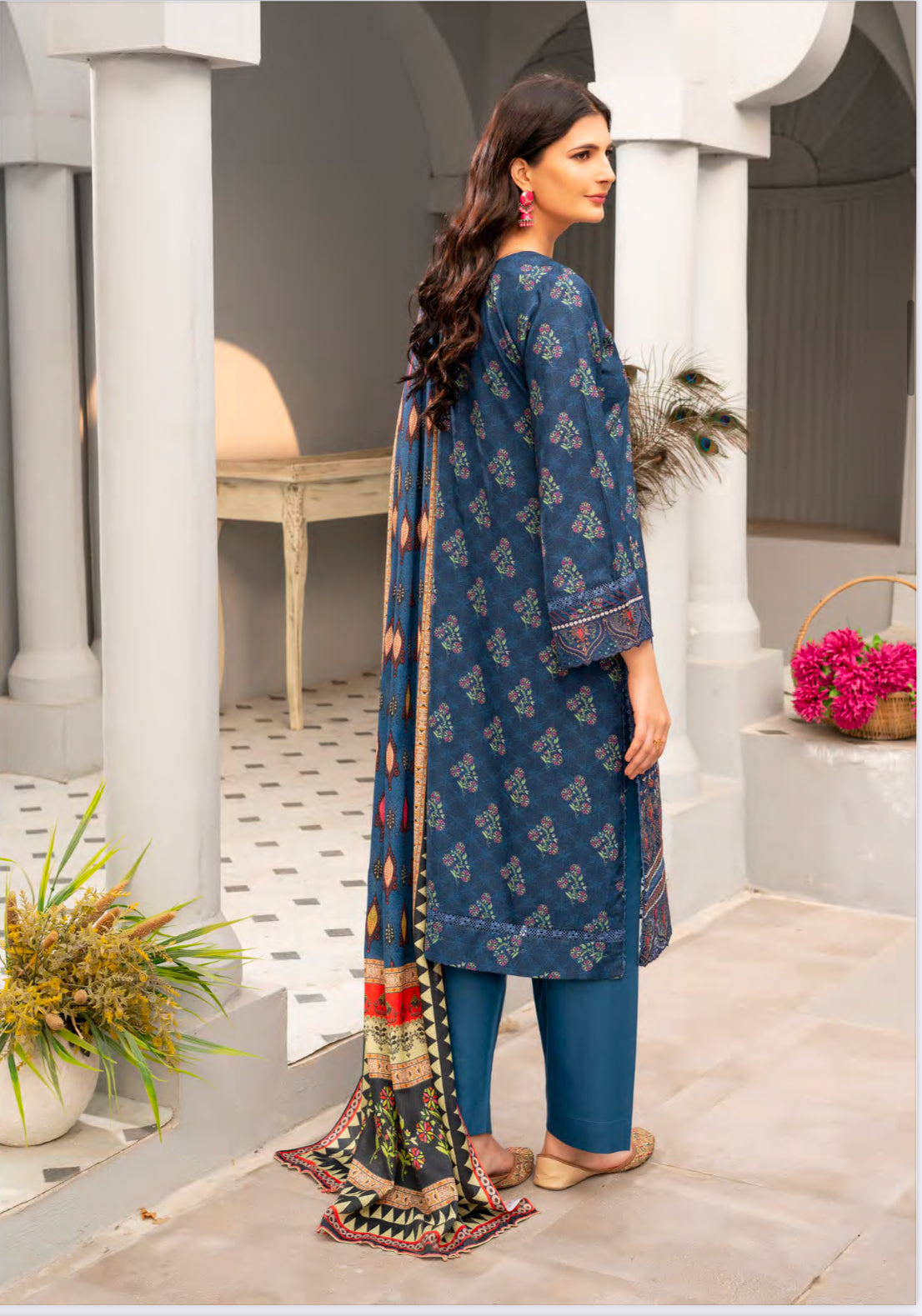 Traditional Pakistani Salwar Kameez by Saree Ghor Charlotte featuring intricate embroidery and vibrant ethnic wear for women.