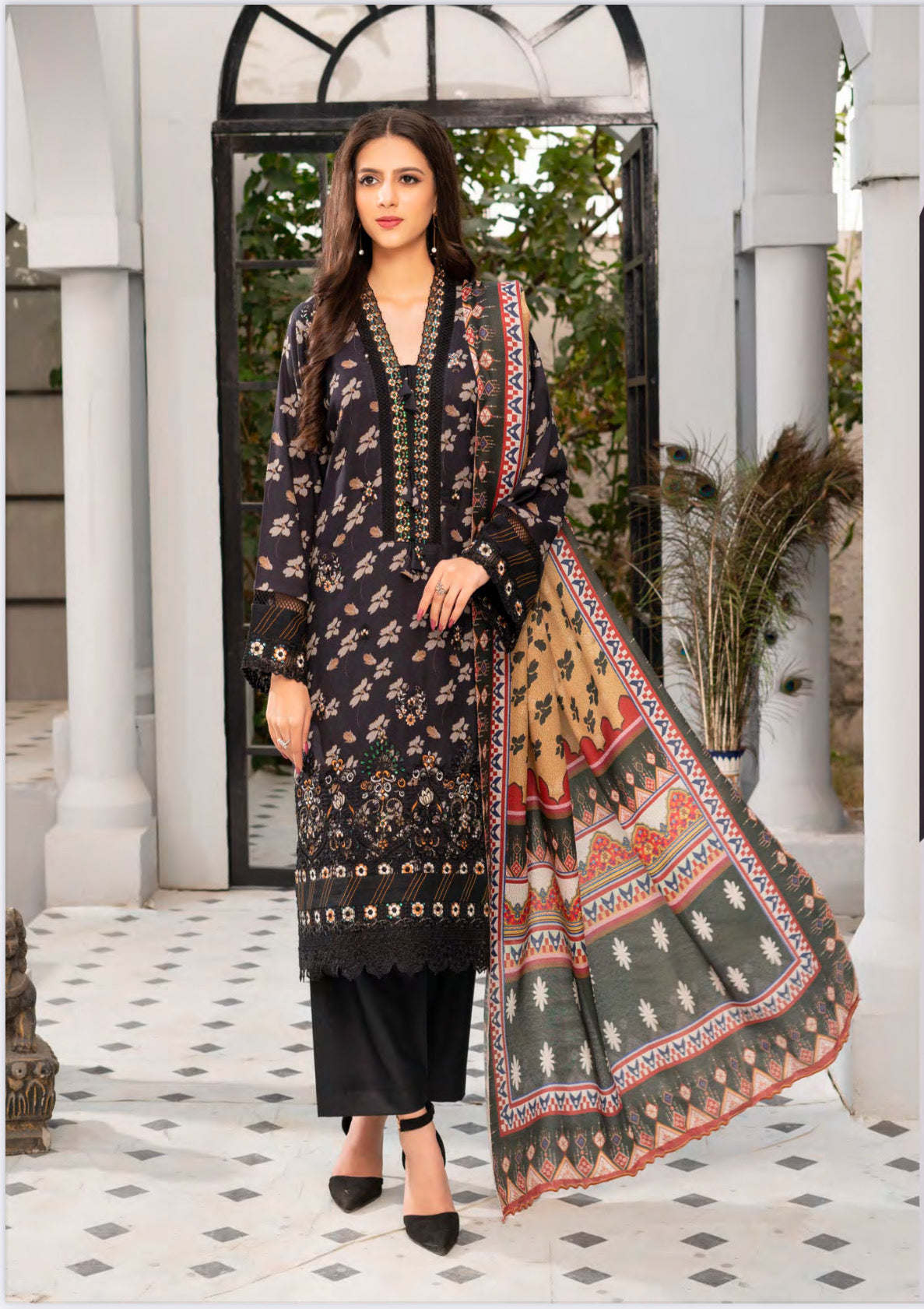 Traditional Pakistani Salwar Kameez by Saree Ghor Charlotte featuring intricate embroidery and vibrant fabric for women's ethnic wear.