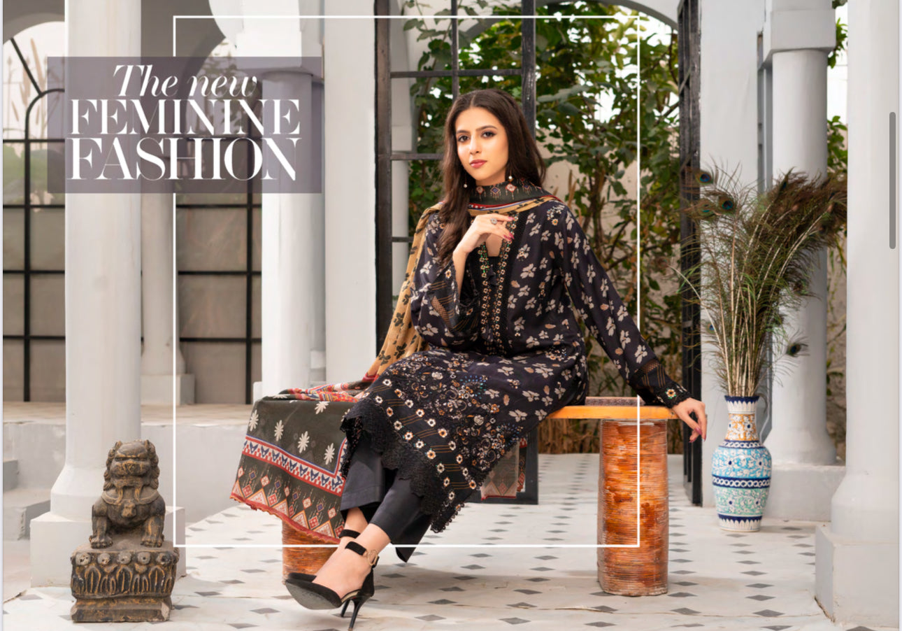 Traditional Pakistani Salwar Kameez by Saree Ghor Charlotte, ethnic wear for women with intricate embroidery and vibrant fabric.