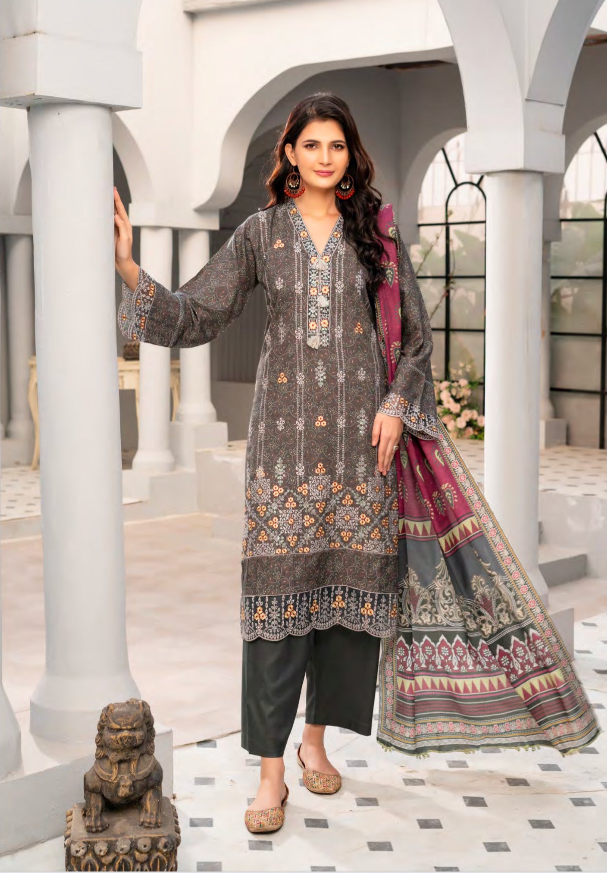 Traditional Pakistani Salwar Kameez from Saree Ghor Charlotte, featuring vibrant ethnic wear for women with intricate patterns.