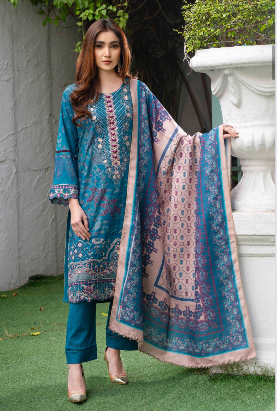 Traditional Pakistani Salwar Kameez by Saree Ghor Charlotte, featuring vibrant ethnic wear for women with intricate patterns.