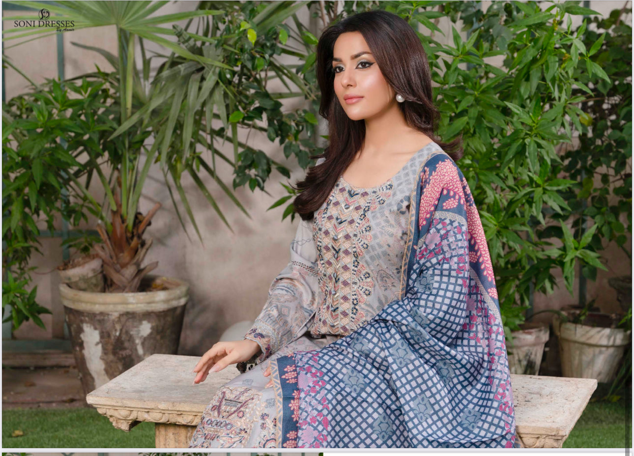 Traditional Pakistani Salwar Kameez by Saree Ghor Charlotte, featuring intricate embroidery and vibrant fabric for women’s ethnic wear.