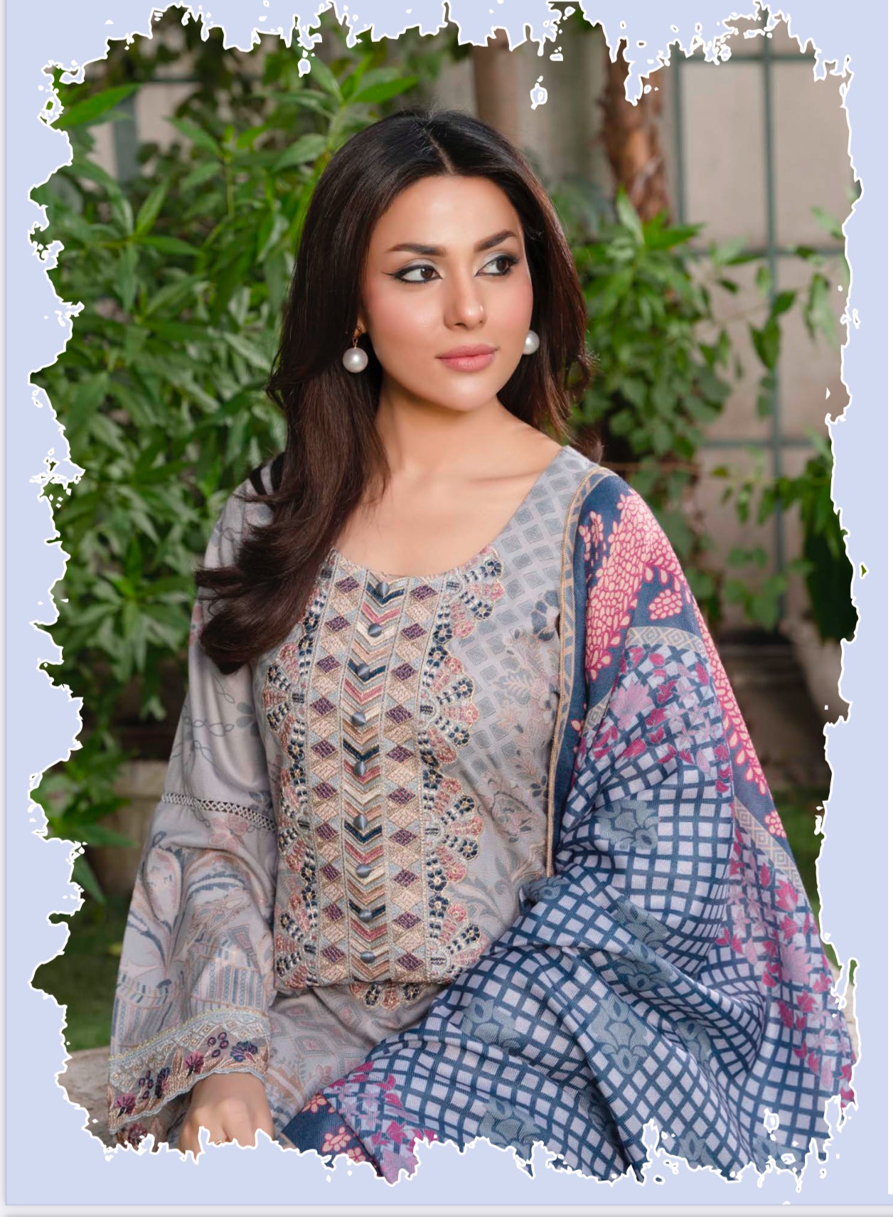 Traditional Pakistani Salwar Kameez by Saree Ghor Charlotte, vibrant ethnic wear for women featuring intricate patterns and colorful fabric.
