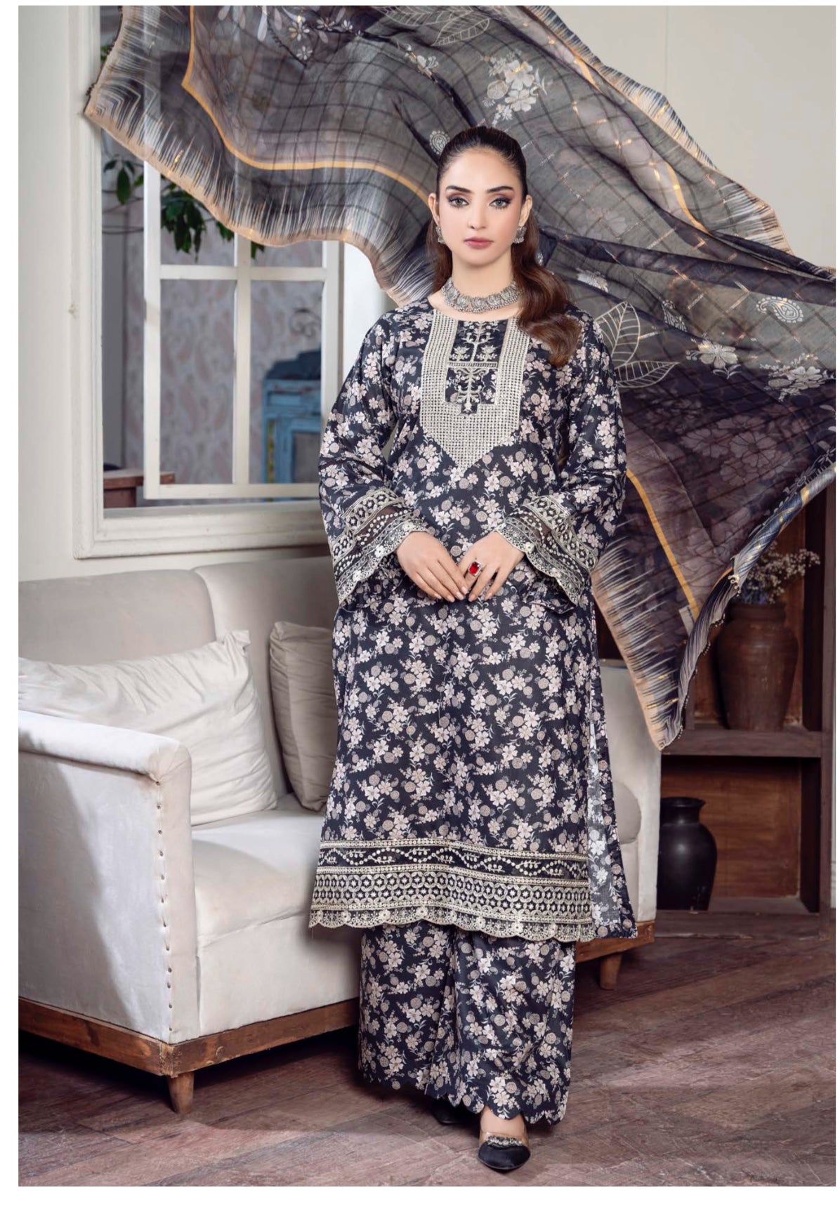 Traditional Pakistani Salwar Kameez by Saree Ghor Charlotte, elegant ethnic wear for women with intricate fabric and vibrant design.