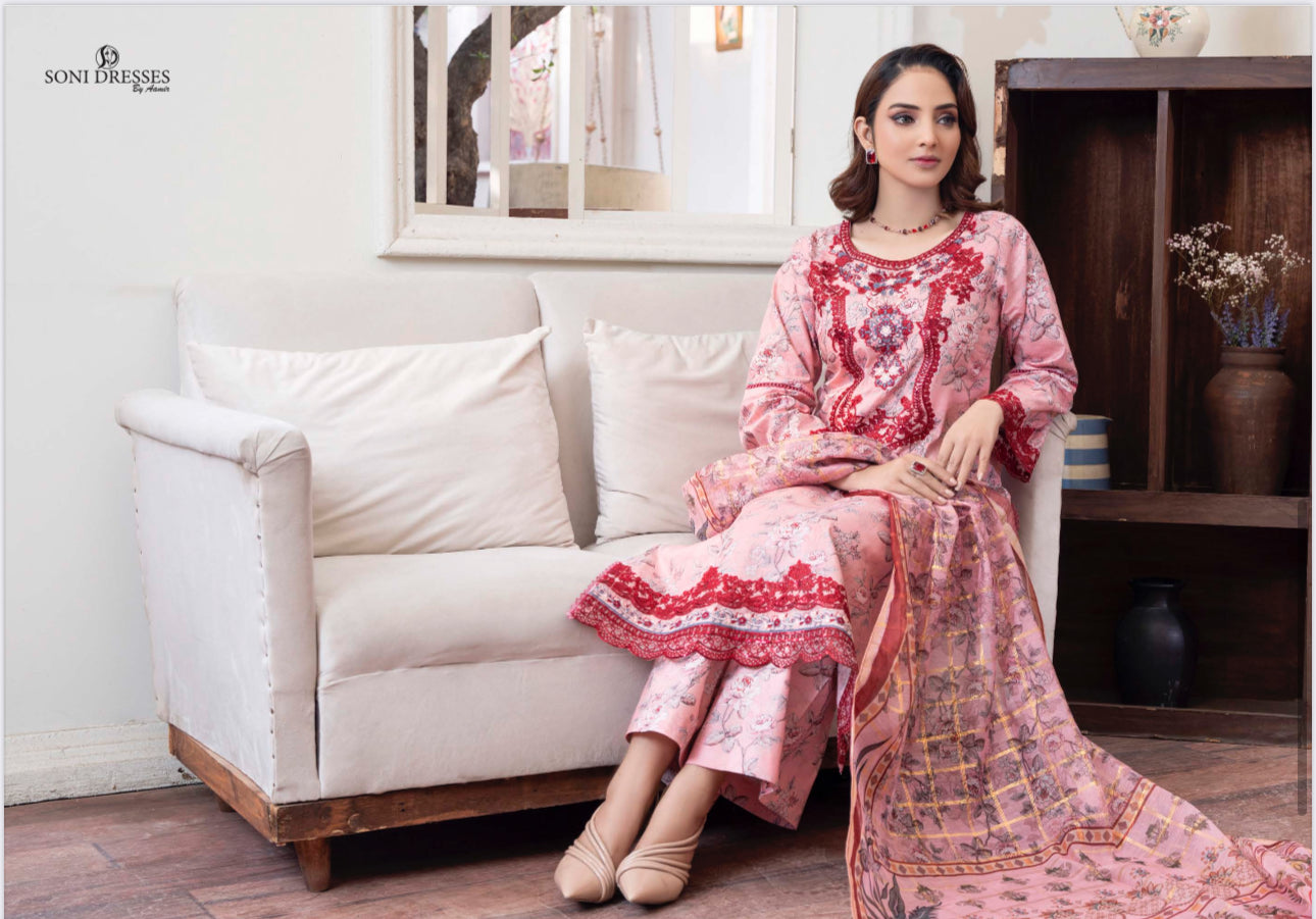 Traditional Pakistani Salwar Kameez by Saree Ghor Charlotte, elegant ethnic wear for women with intricate patterns and vibrant colors.