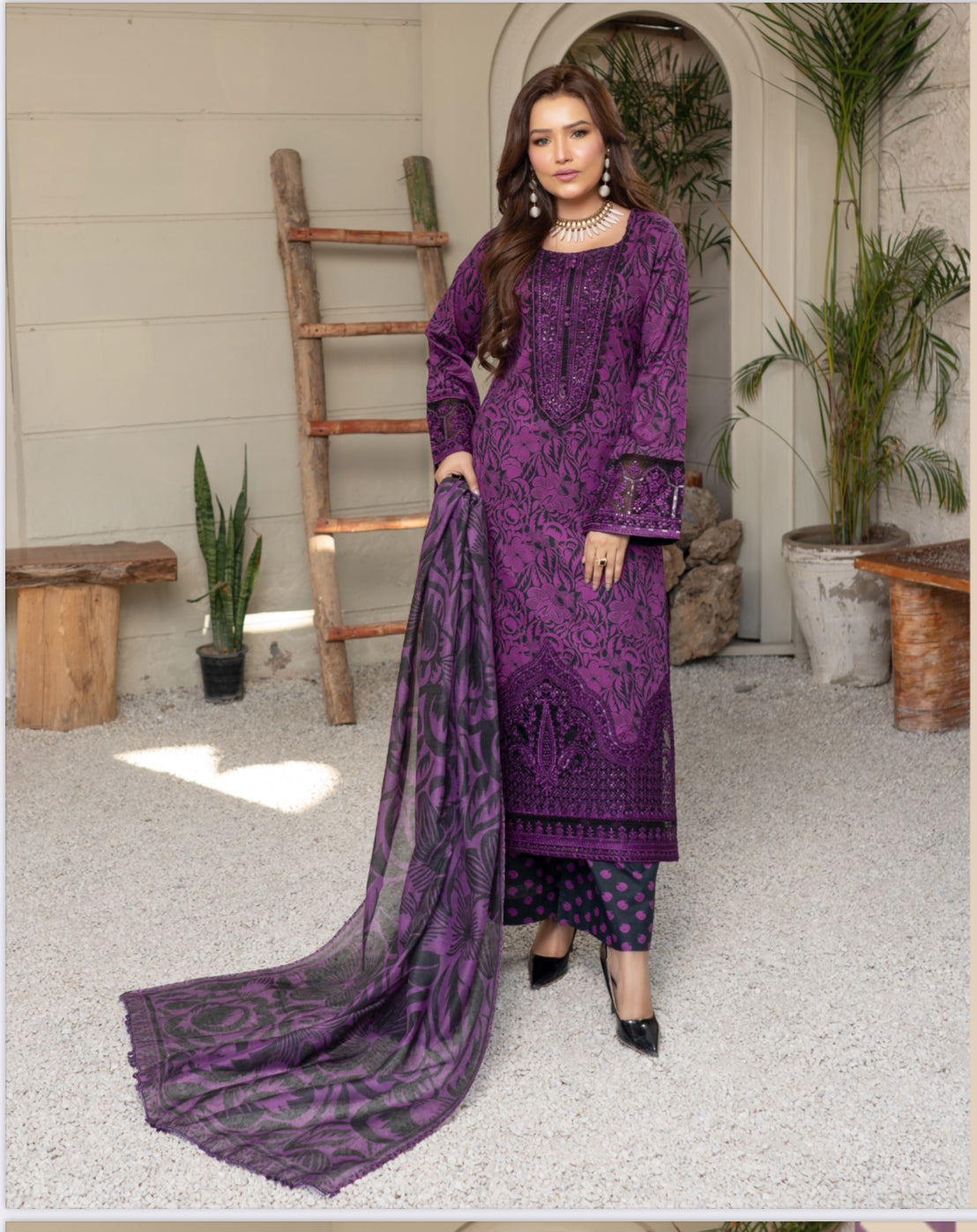 Traditional Pakistani Salwar Kameez by Saree Ghor Charlotte featuring intricate embroidery and vibrant fabric for women.