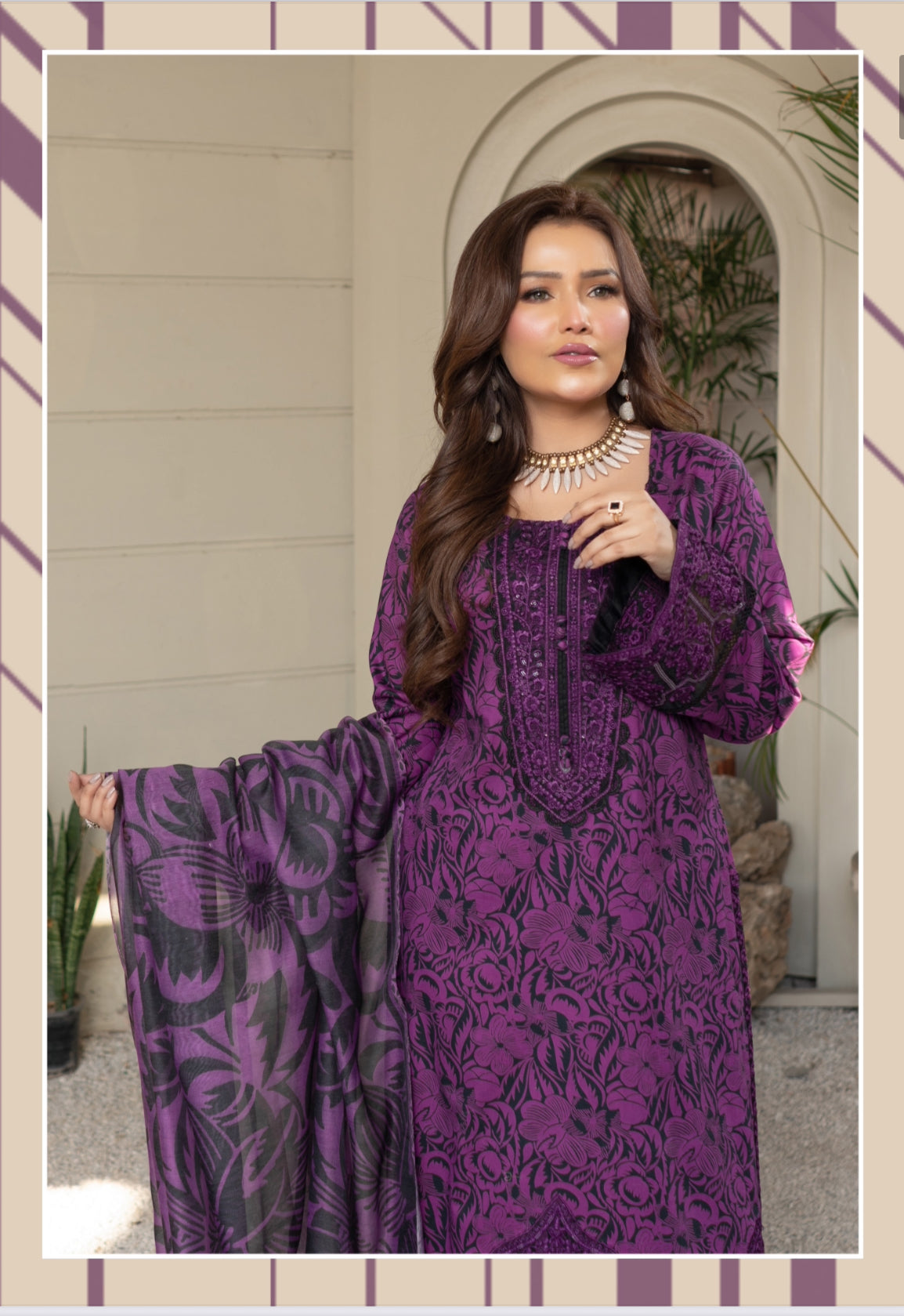 Traditional Pakistani Salwar Kameez by Saree Ghor Charlotte, ethnic women's wear with intricate embroidery and vibrant fabric.