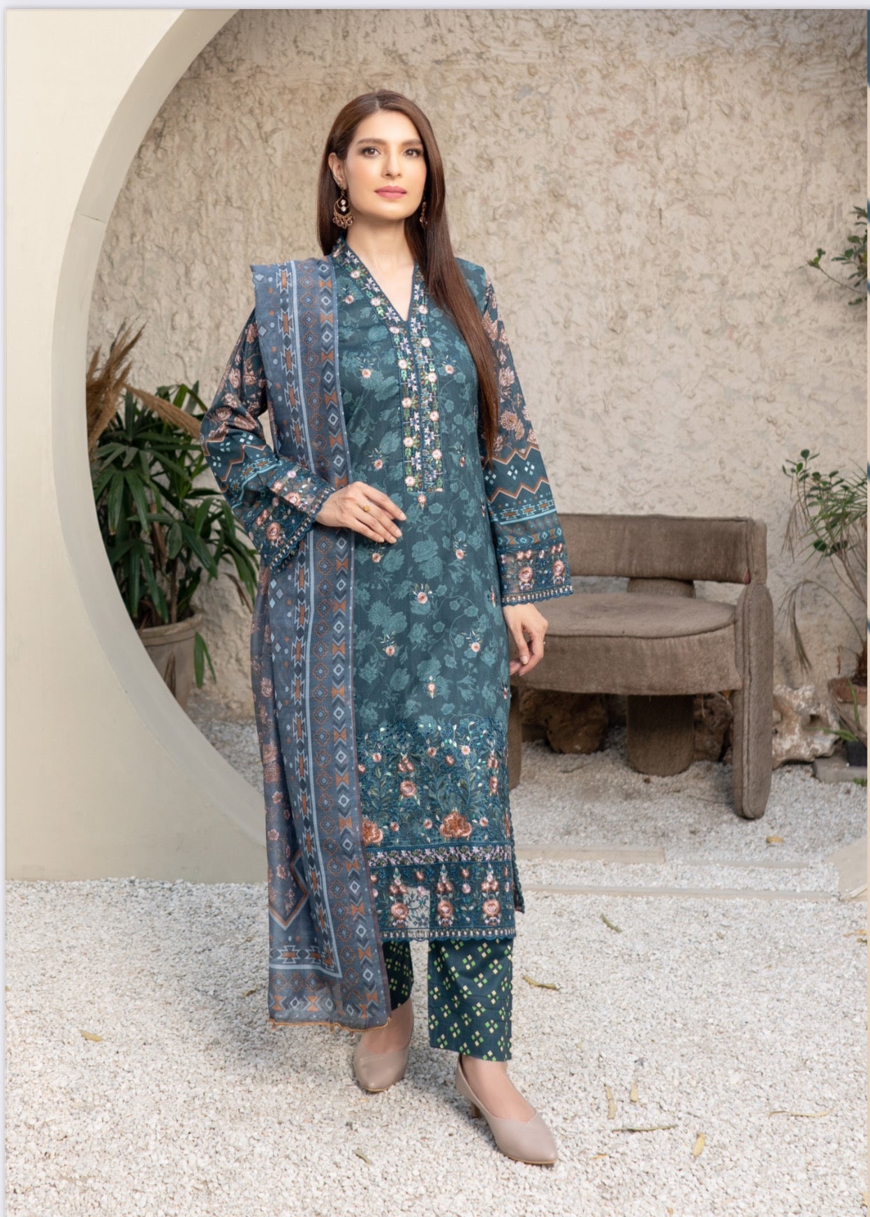 Traditional Pakistani Salwar Kameez by Saree Ghor Charlotte, elegant ethnic wear for women with intricate fabric and vibrant colors.