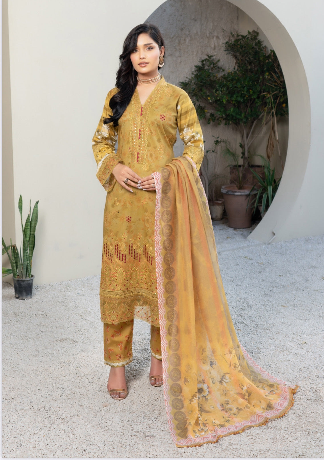 Traditional Pakistani Salwar Kameez by Saree Ghor Charlotte, ethnic women’s cultural wear with intricate embroidery and vibrant fabric.