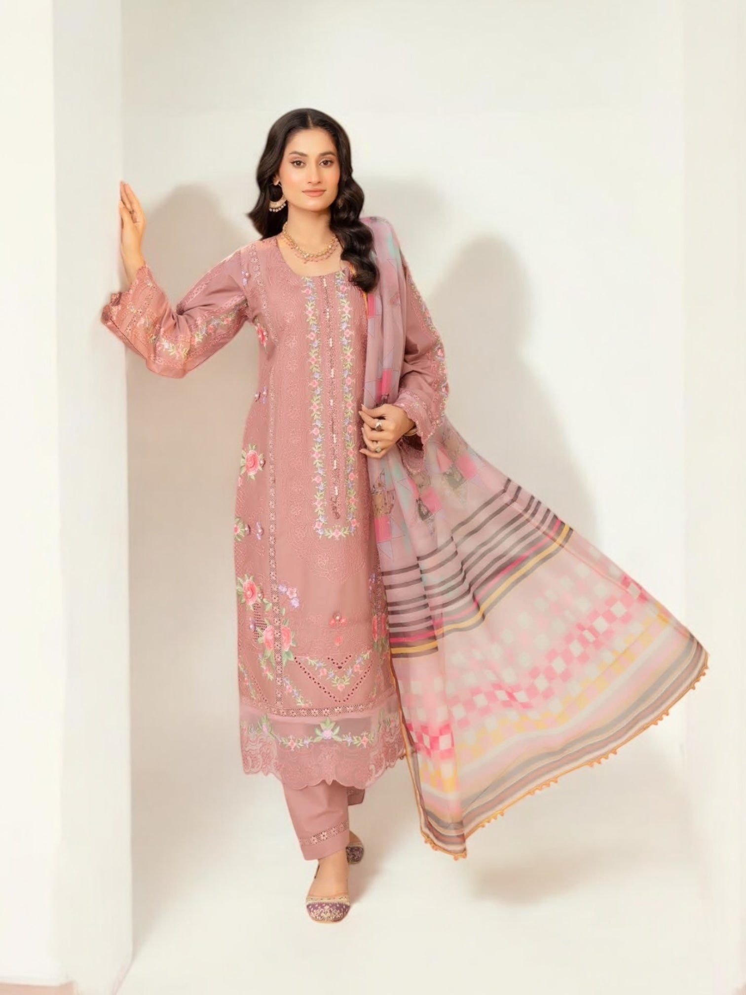 Traditional Pakistani Salwar Kameez by Saree Ghor Charlotte, ethnic women's wear with intricate embroidery and vibrant fabrics.