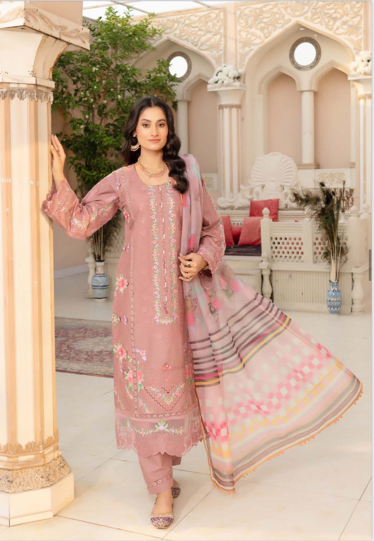 Traditional Pakistani Salwar Kameez by Saree Ghor Charlotte, colorful ethnic wear for women with intricate embroidery and vibrant fabric.