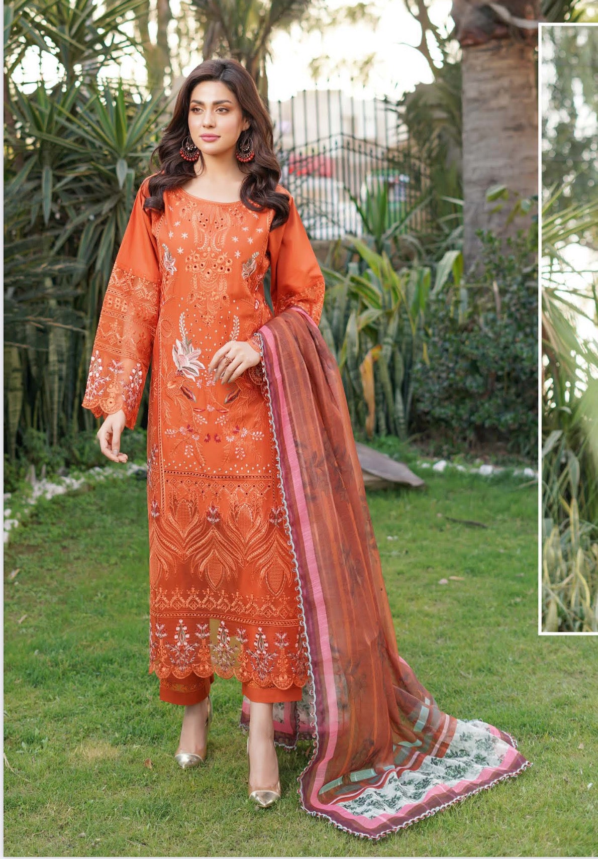 Traditional Pakistani Salwar Kameez by Saree Ghor Charlotte, vibrant ethnic wear for women with intricate patterns and colorful fabric.