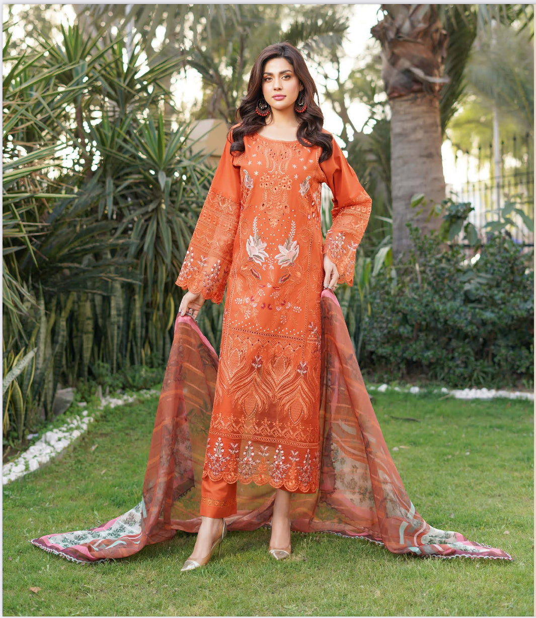 Traditional Pakistani Salwar Kameez by Saree Ghor Charlotte, featuring vibrant ethnic wear with intricate designs for women.