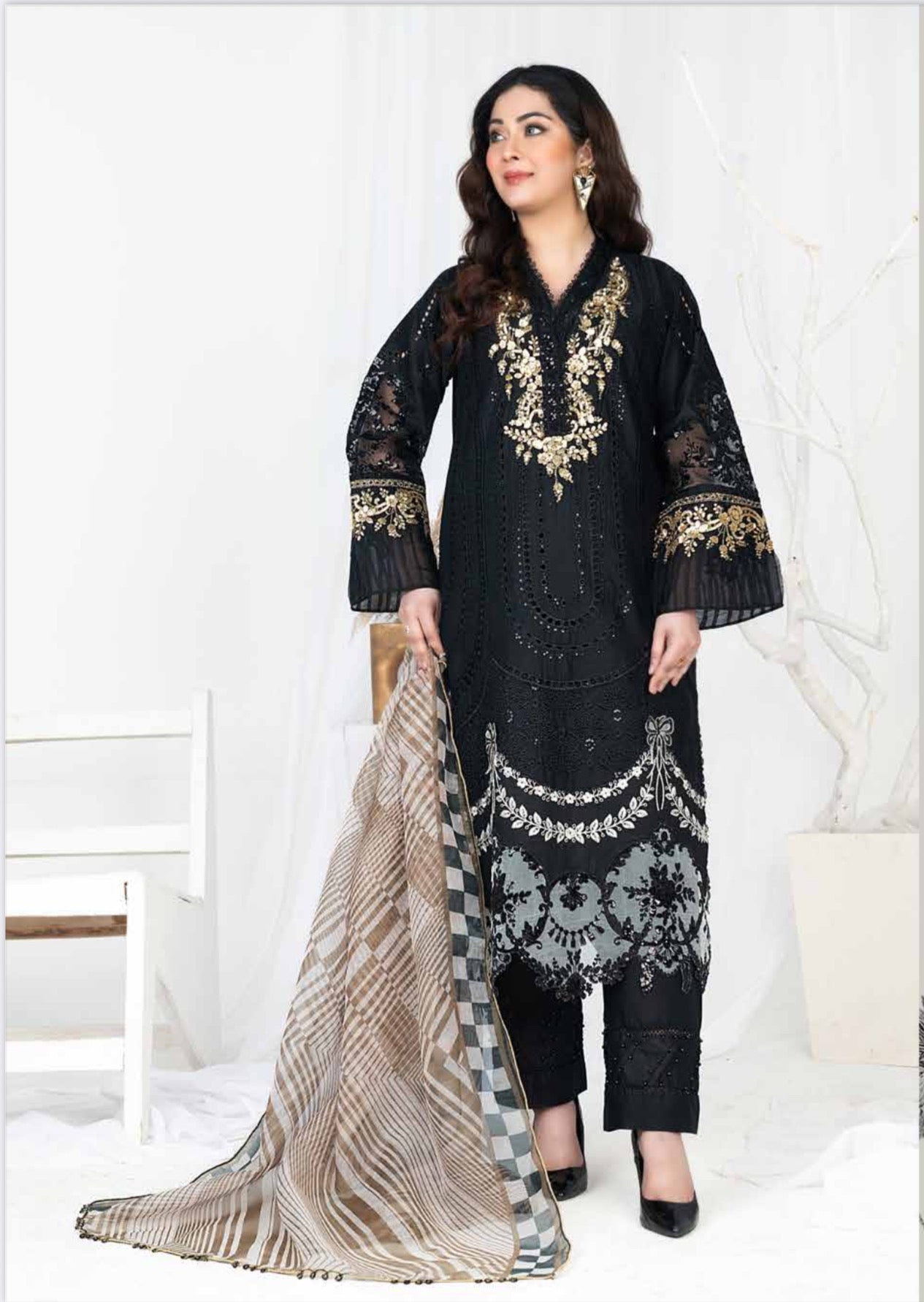 Traditional Pakistani Salwar Kameez by Saree Ghor Charlotte, featuring vibrant ethnic wear for women with intricate details.