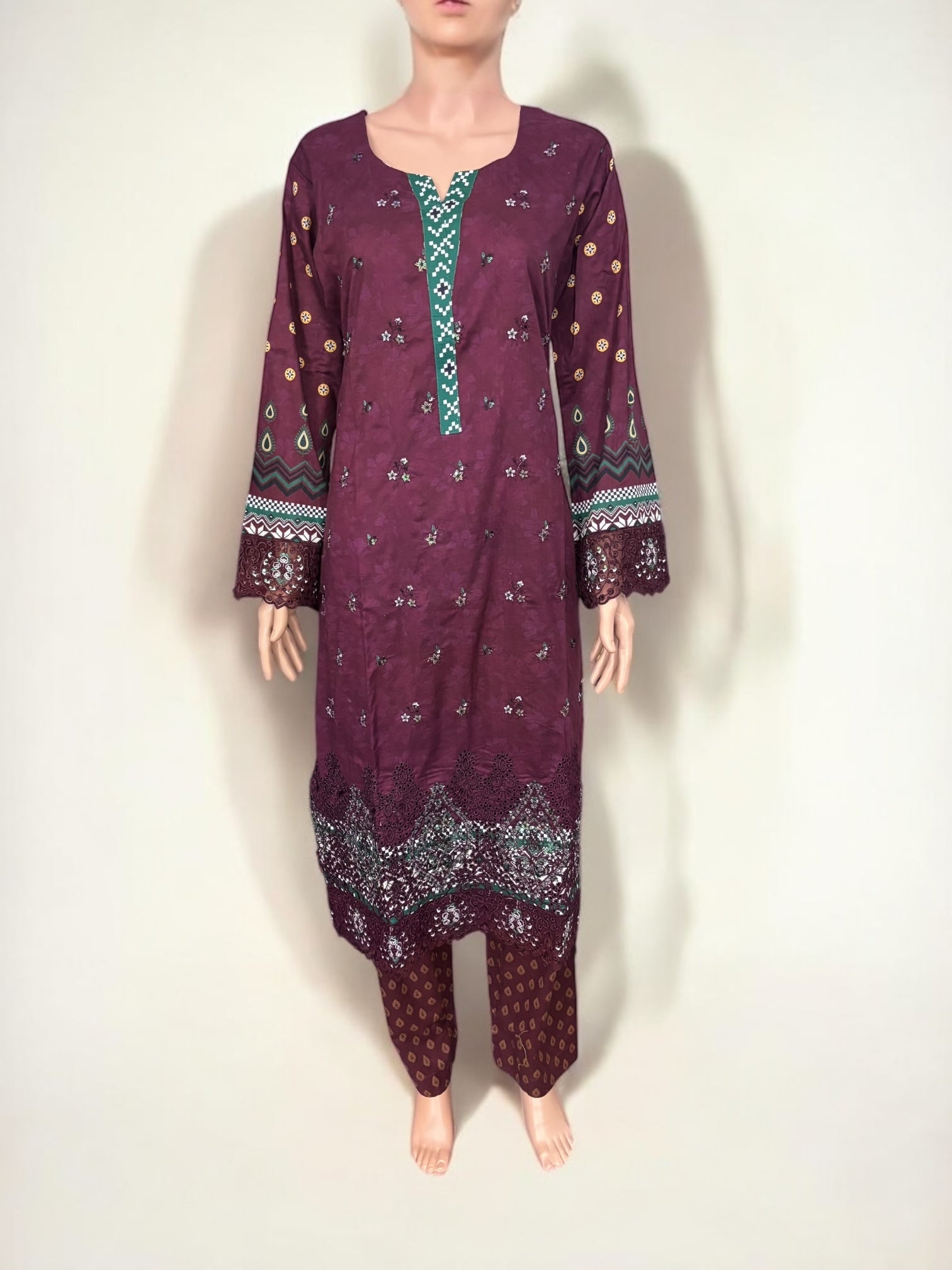 Traditional Pakistani Salwar Kameez by Saree Ghor Charlotte, featuring intricate embroidery and vibrant ethnic wear for women.