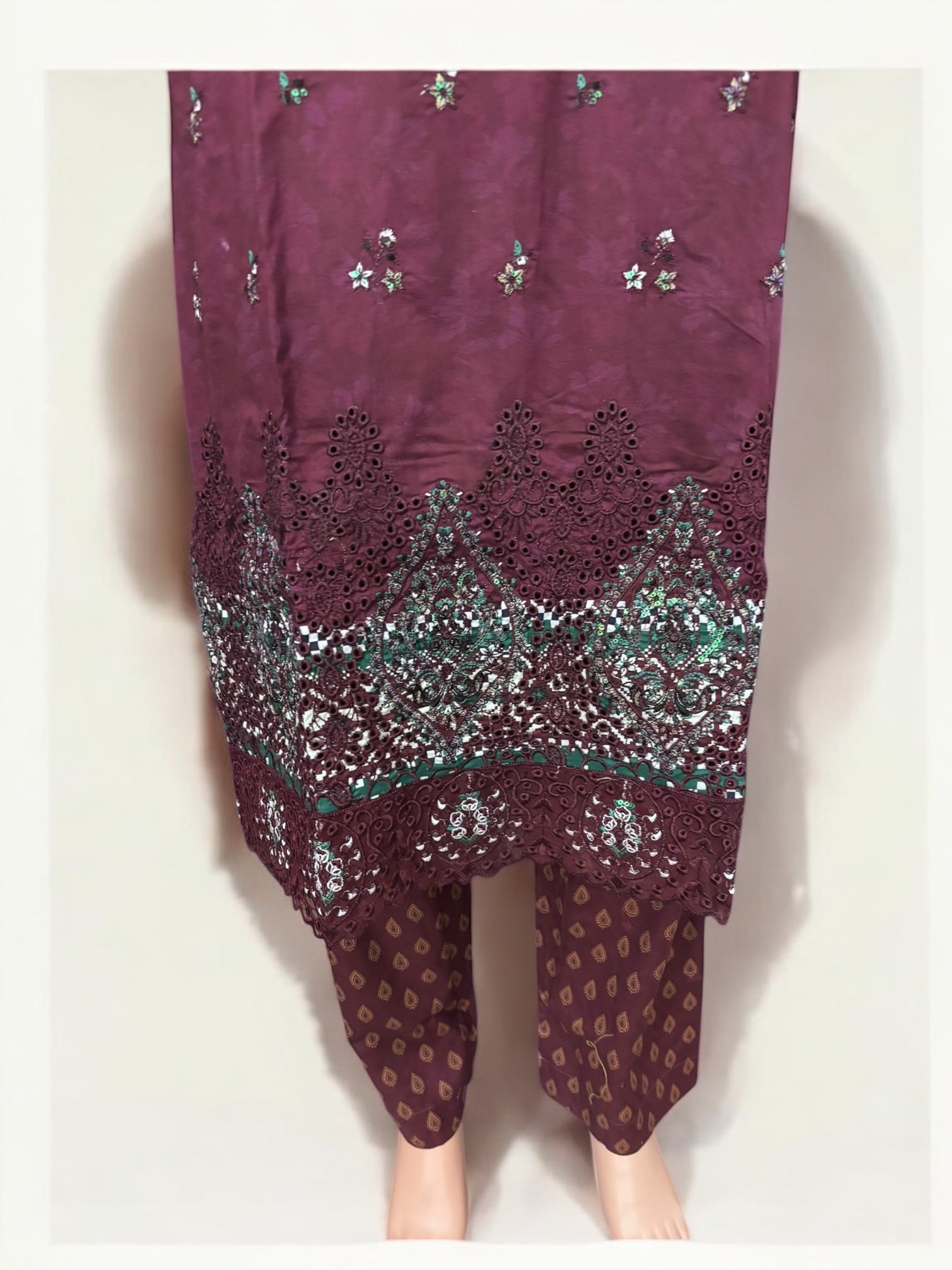 Traditional Pakistani Salwar Kameez by Saree Ghor Charlotte, ethnic wear for women featuring vibrant fabric and intricate design.